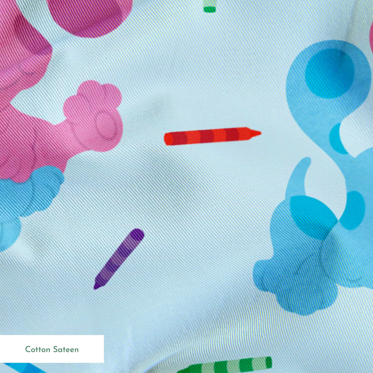 Playful pattern of cartoon blue and pink dogs with colorful stick accents on light blue background springs sateen texture