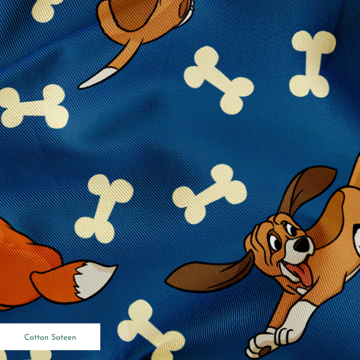 Fox and the Hound characters playing against blue background with scattered bone pattern springs sateen texture