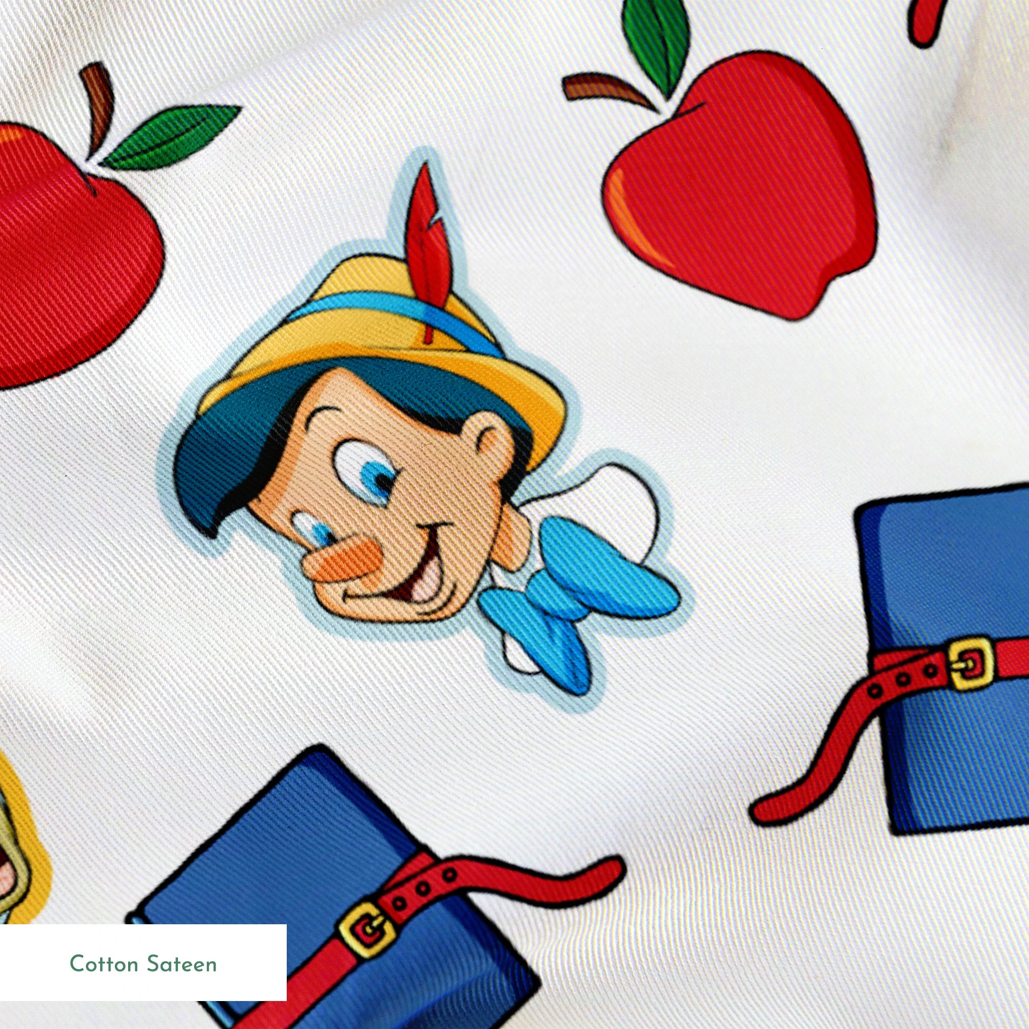 Pattern with cartoon character in pointed hat with blue bow, red apples, blue books with red straps, and yellow circular elements on white background springs sateen texture