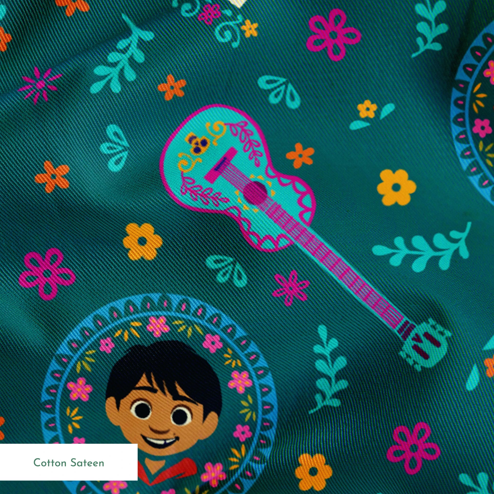 Colorful Coco-inspired pattern with guitars, sugar skulls, circular portraits, and floral elements on teal background. springs sateen texture
