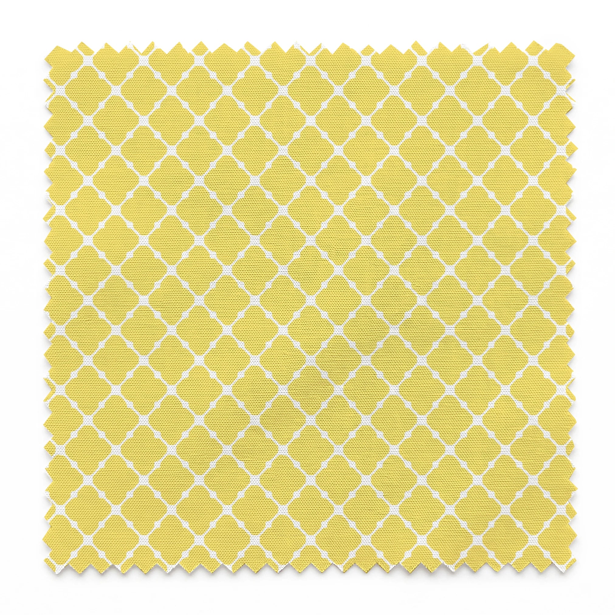 Yellow quatrefoil pattern on white background with Moroccan tile inspired design springs swatch pinked