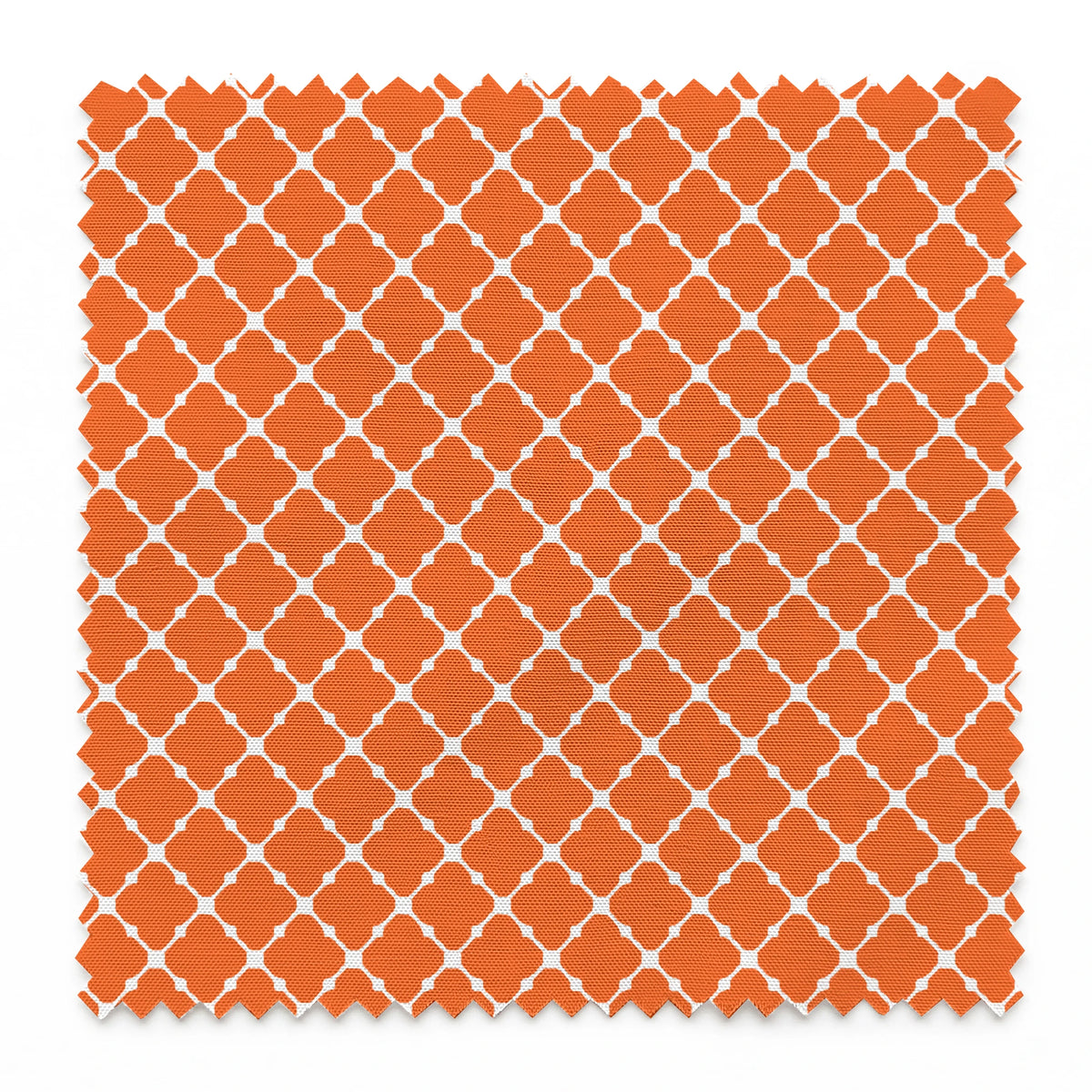 Burnt Orange and white quatrefoil pattern with smooth lattice design on orange background springs swatch pinked