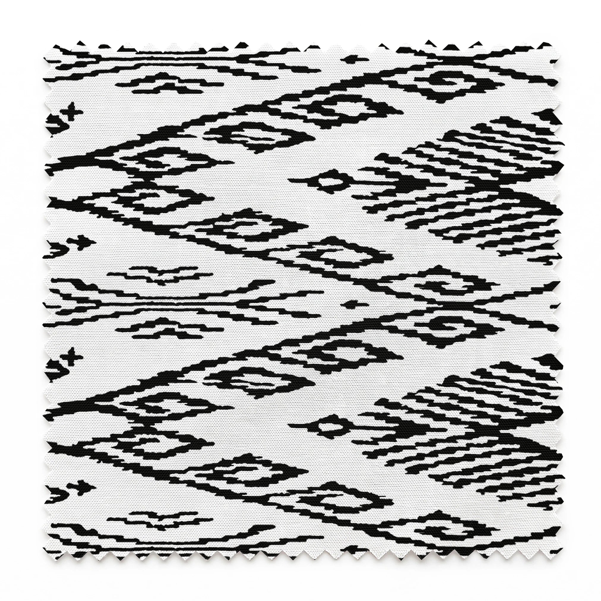 Black and white geometric pattern with diamond shapes and zigzag motifs on a textile surface springs swatch pinked