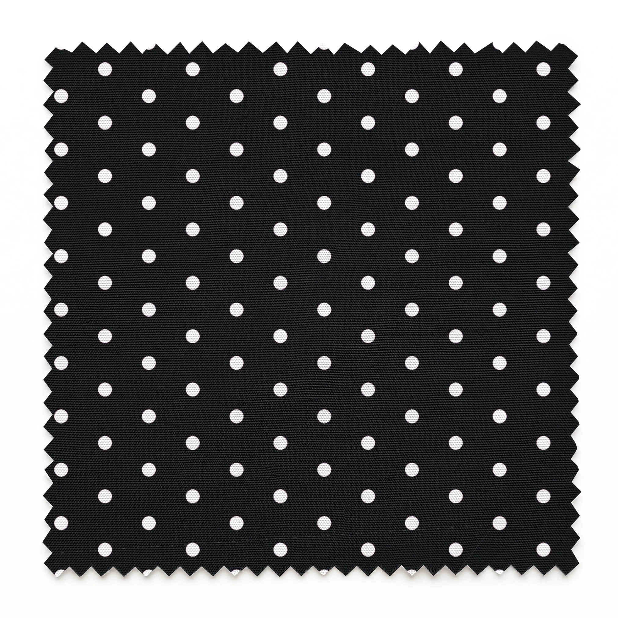 White circular dots on a black background springs swatch pinked