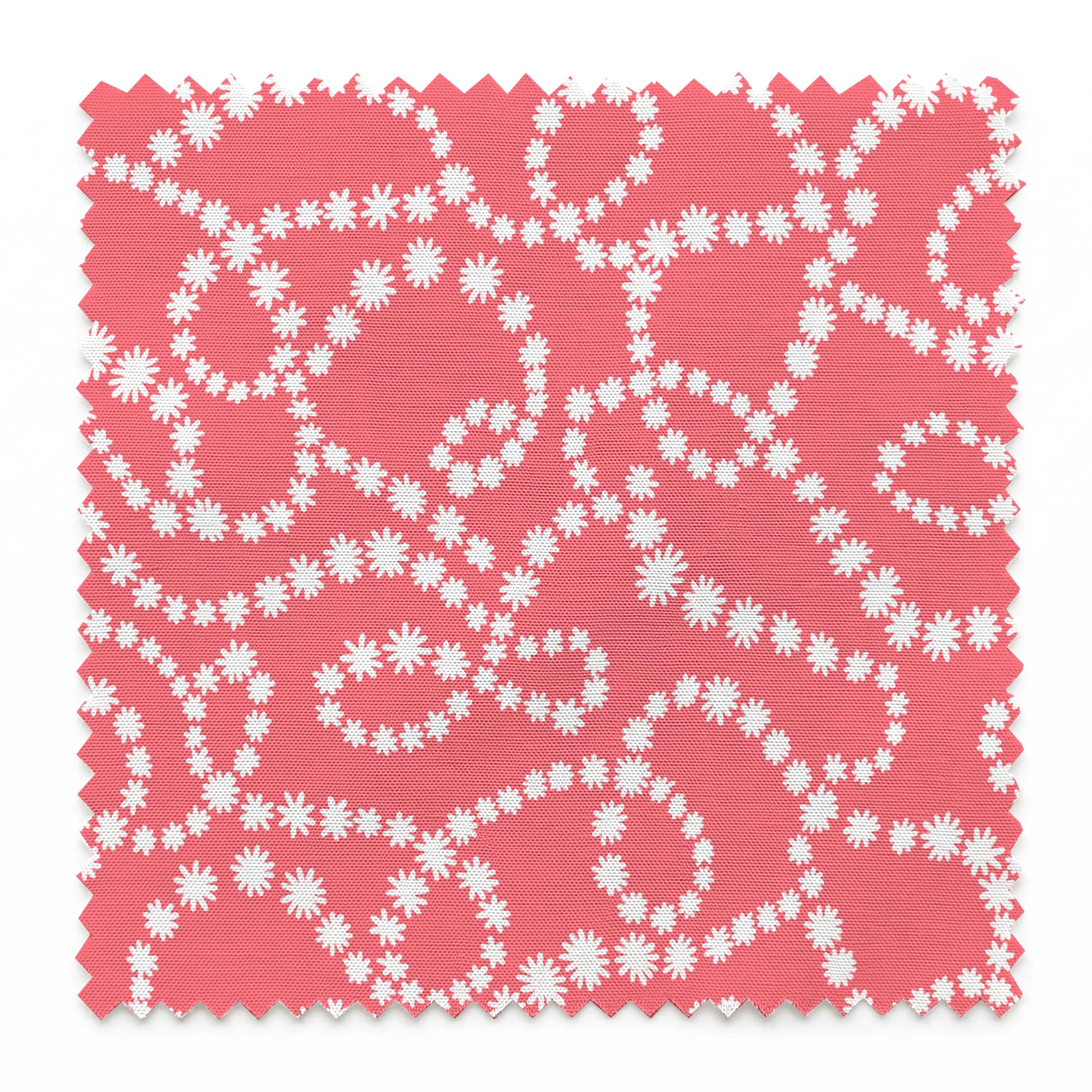 White dot patterns forming swirling chains on coral pink background springs swatch pinked