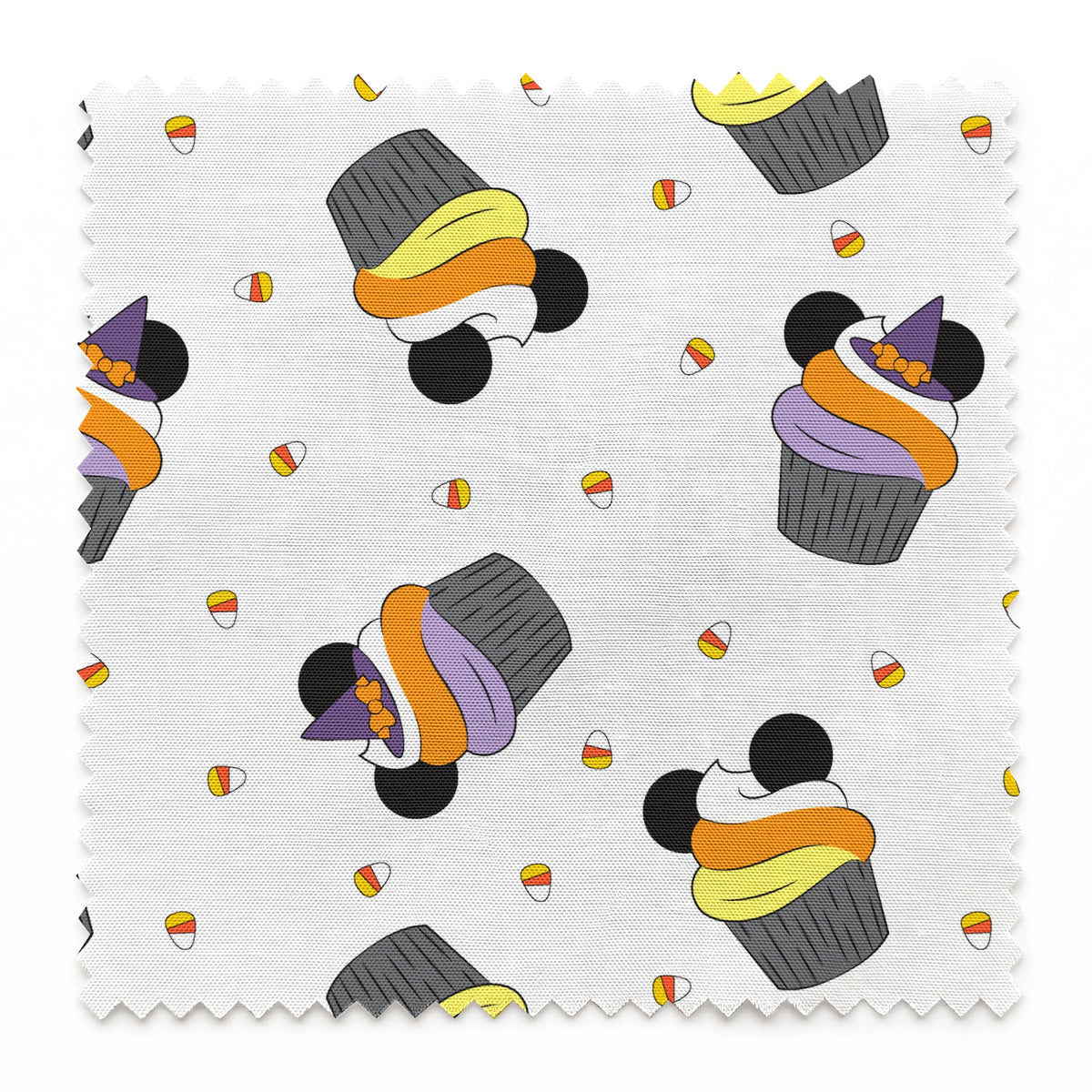 Disney cupcakes with black circular elements and colorful frosting in orange, yellow, and purple on a white background. springs swatch pinked