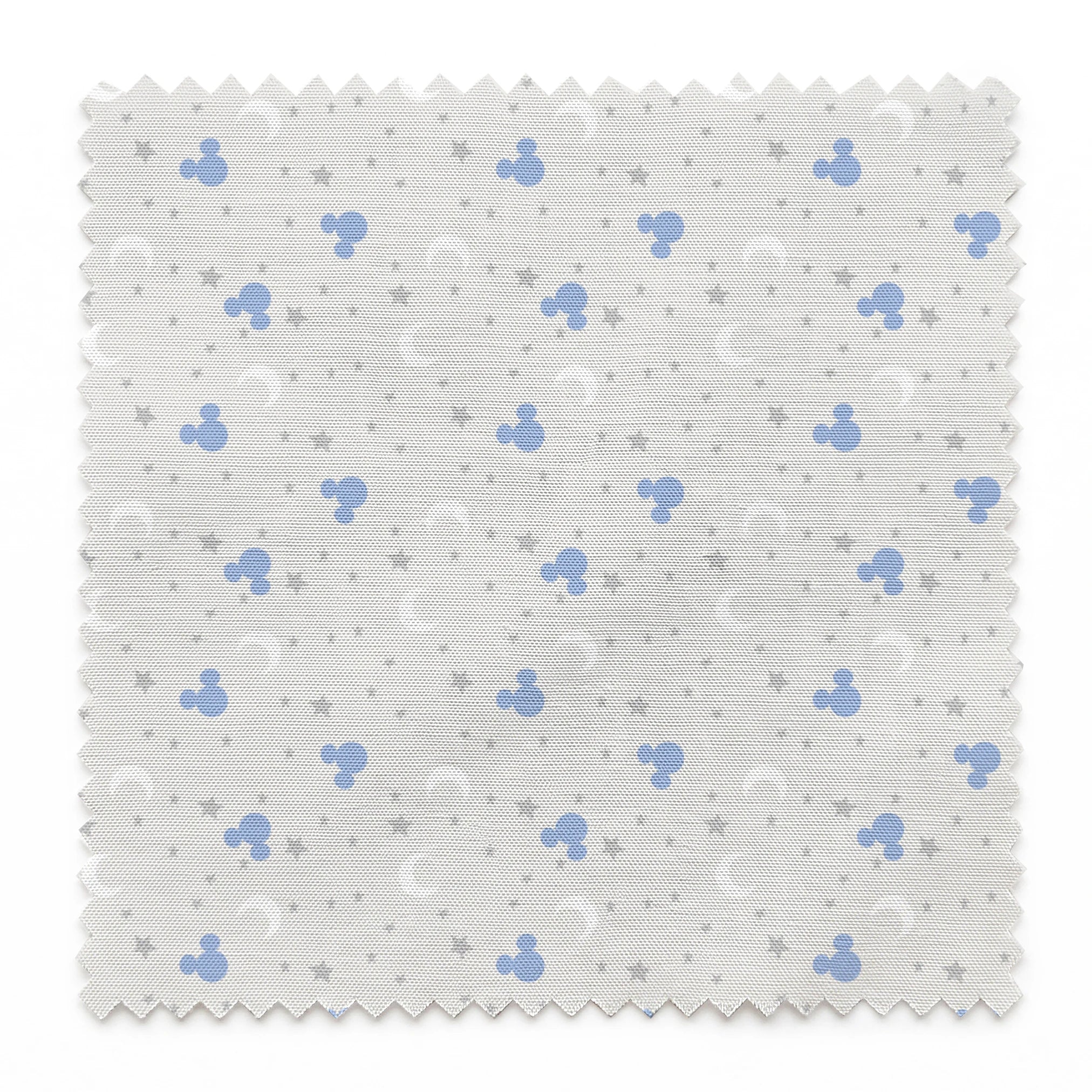 Blue Mickey Mouse silhouettes with white moons and gray stars on light gray background springs swatch pinked