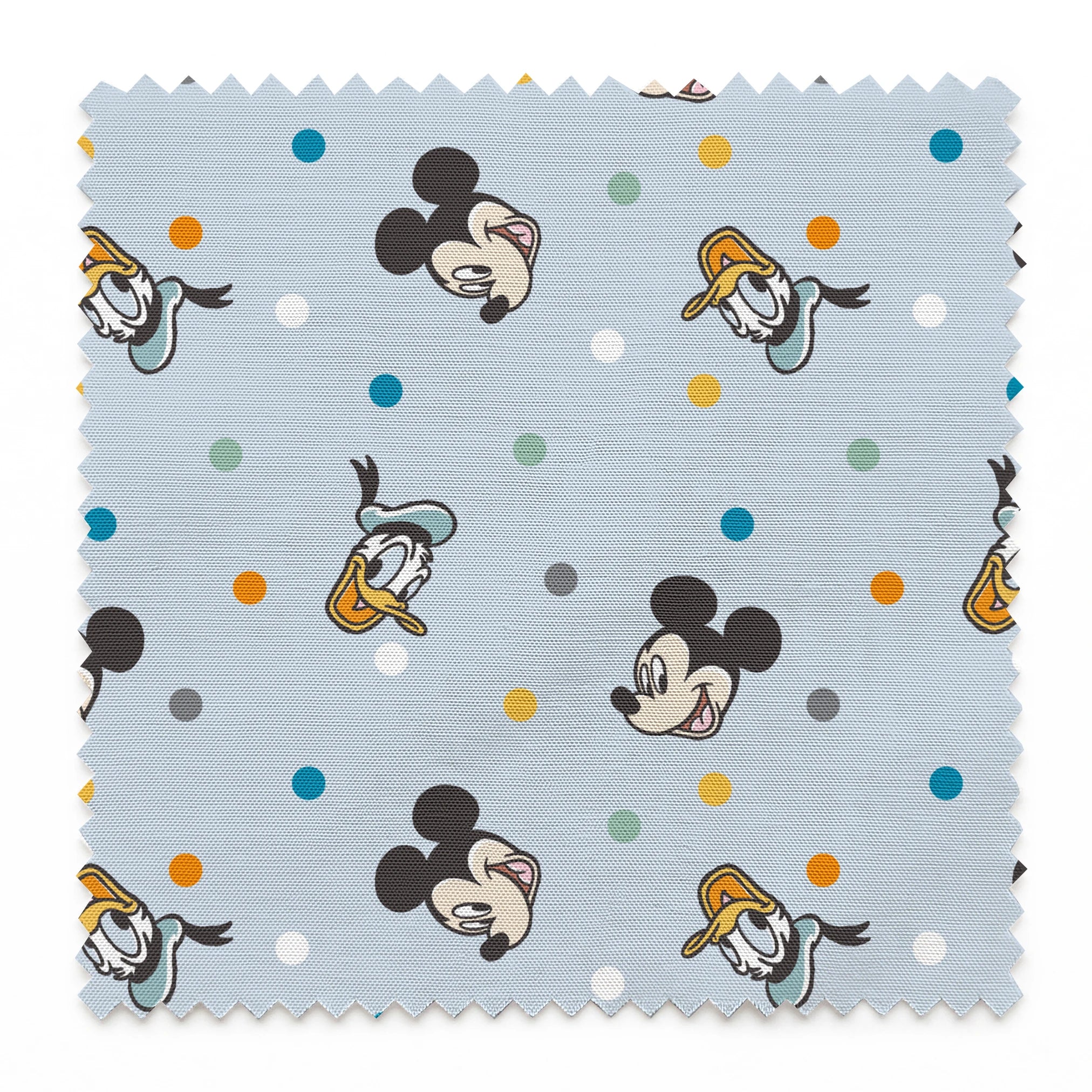 Disney character pattern with Mickey Mouse and Donald Duck heads scattered on light blue background with colorful polka dots springs swatch pinked