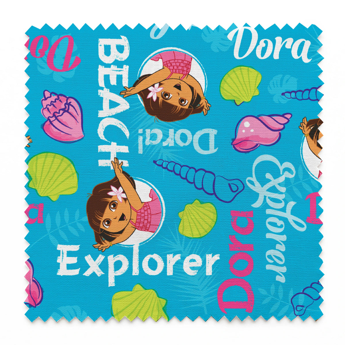 Bright blue pattern featuring Dora the Explorer cartoon character with seashells and "Beach Explorer" text springs swatch pinked