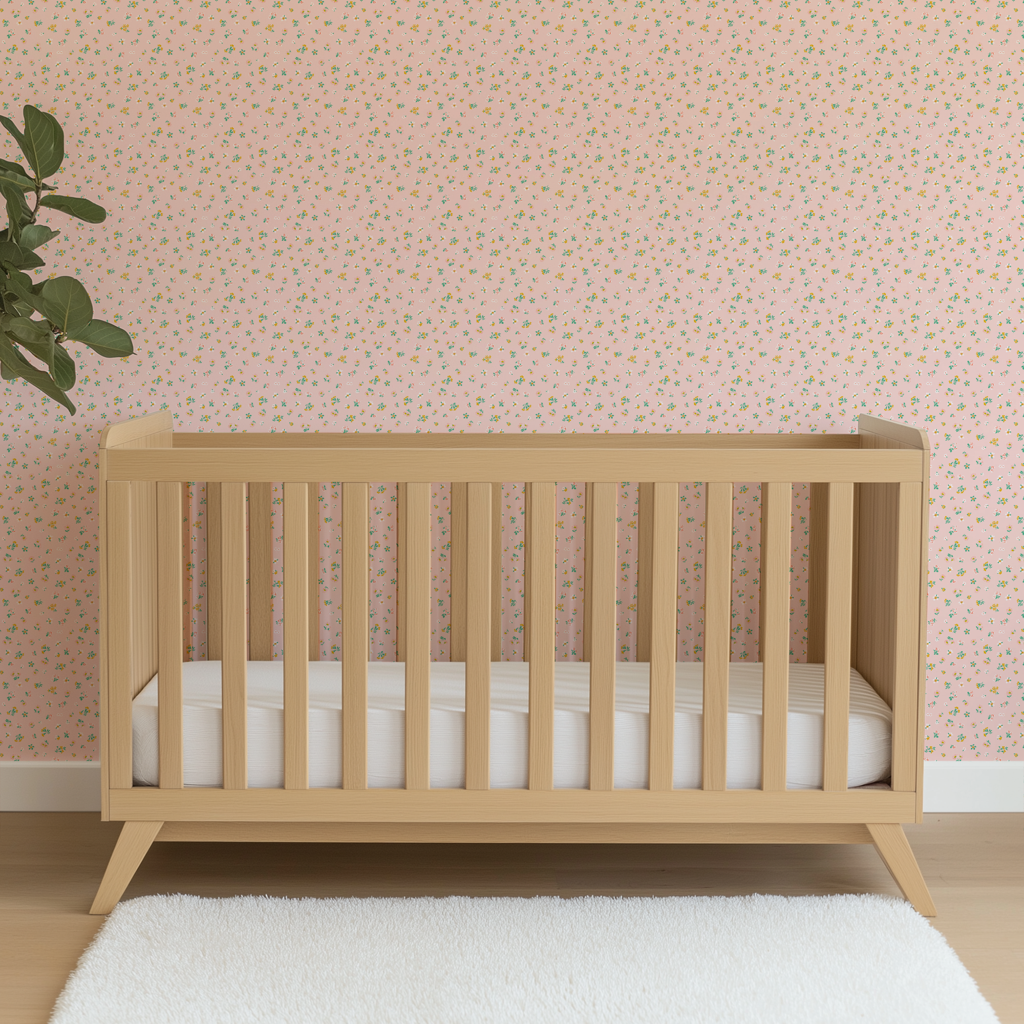 Small floral pattern on pink background with white daisies and yellow, blue, and pink flowers wallpaper crib mockup