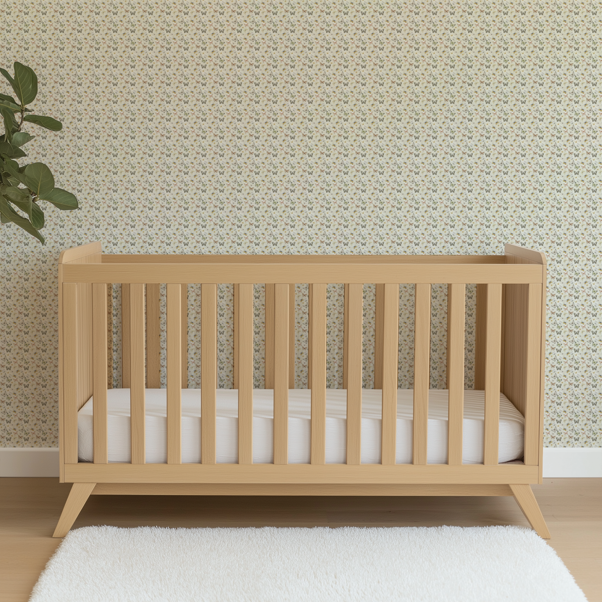 Hand-illustrated pastel butterflies in pink, blue, yellow, and sage on a cream background in a botanical-style Nicole Tamarin design. wallpaper crib mockup