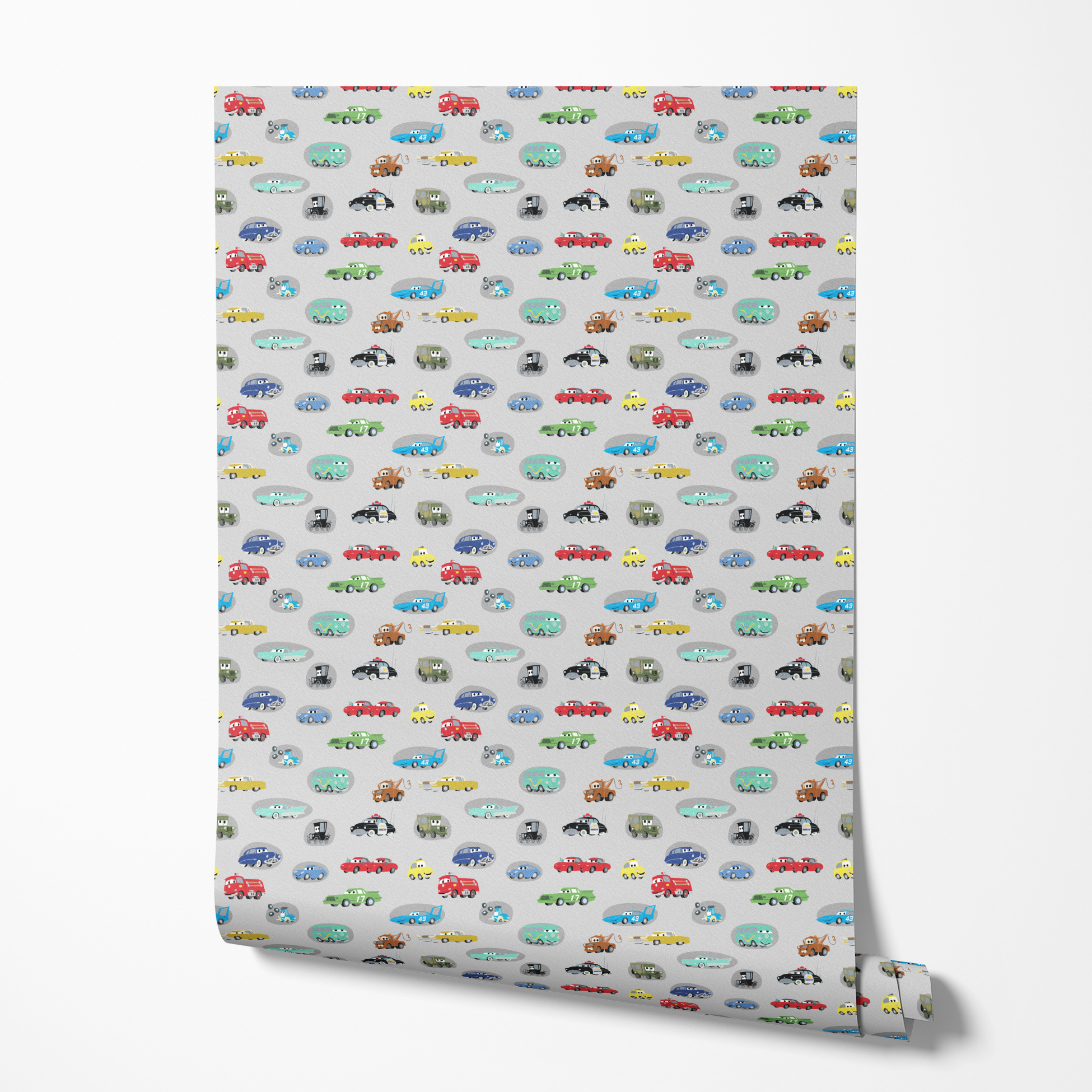 Various cartoon toy cars and vehicles in different colors (red, blue, green, yellow) displayed against a gray background with cute animated faces. wallpaper roll mockup