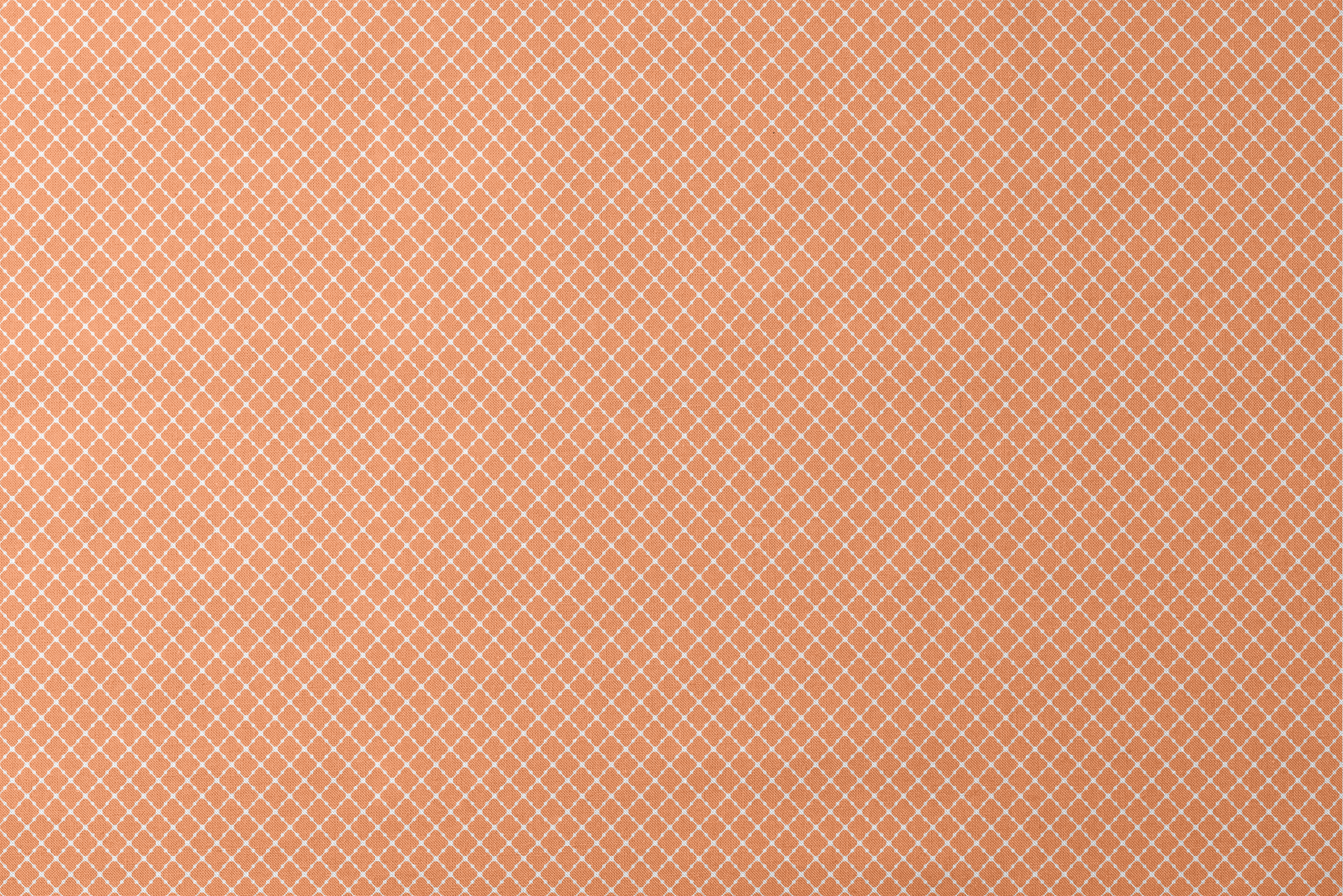 Geometric orange and white pattern with quatrefoil shapes forming a lattice design designs flat mockup