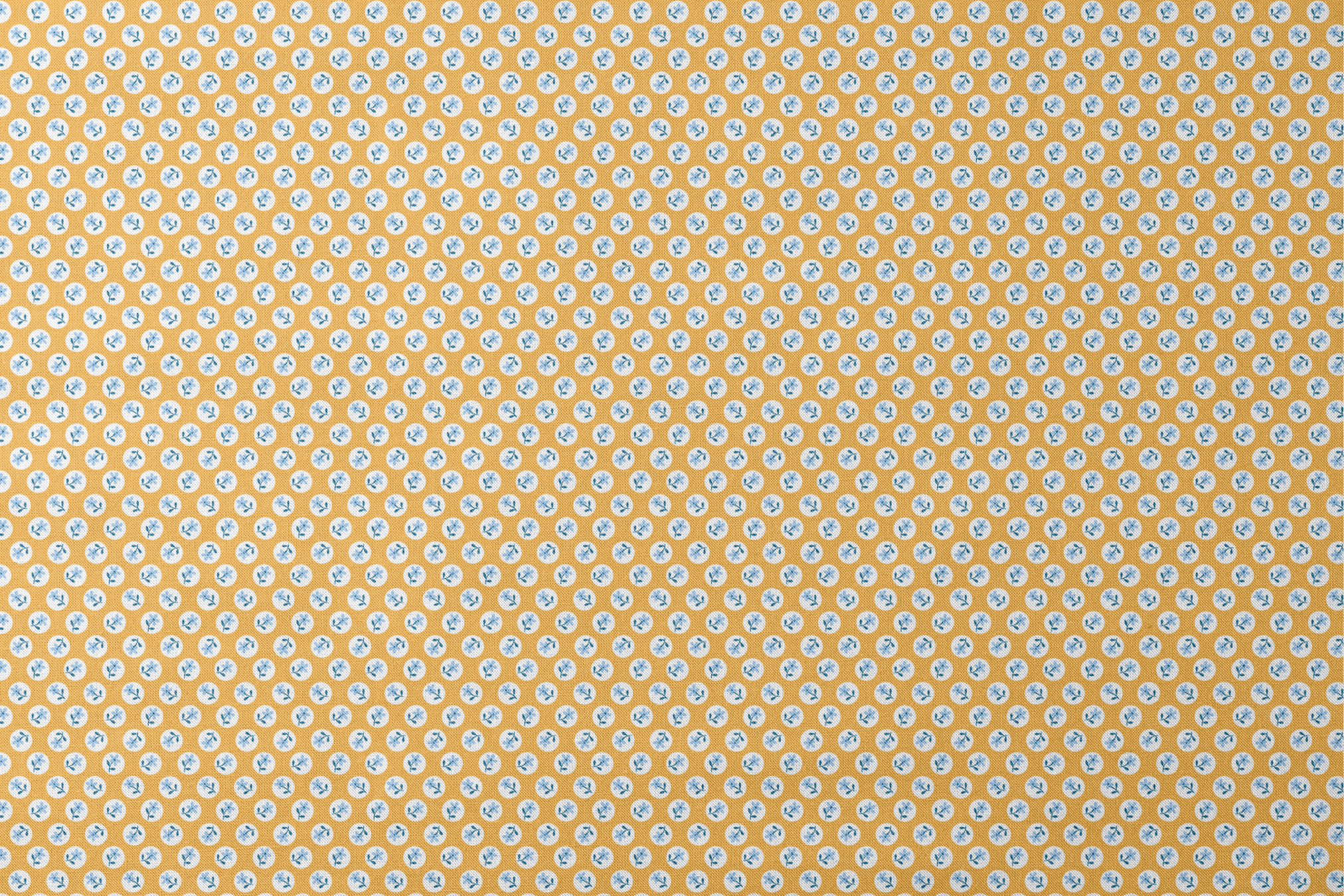 Light blue flowers with navy stems in white circles on a mustard yellow background designs flat mockup