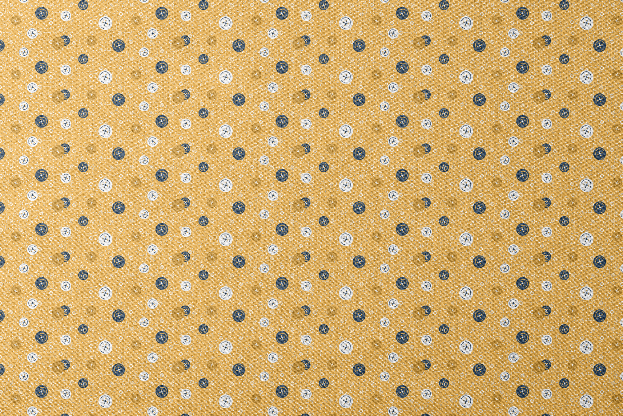 Circular buttons with cross symbols in gold, navy, and white scattered on a gold floral background designs flat mockup