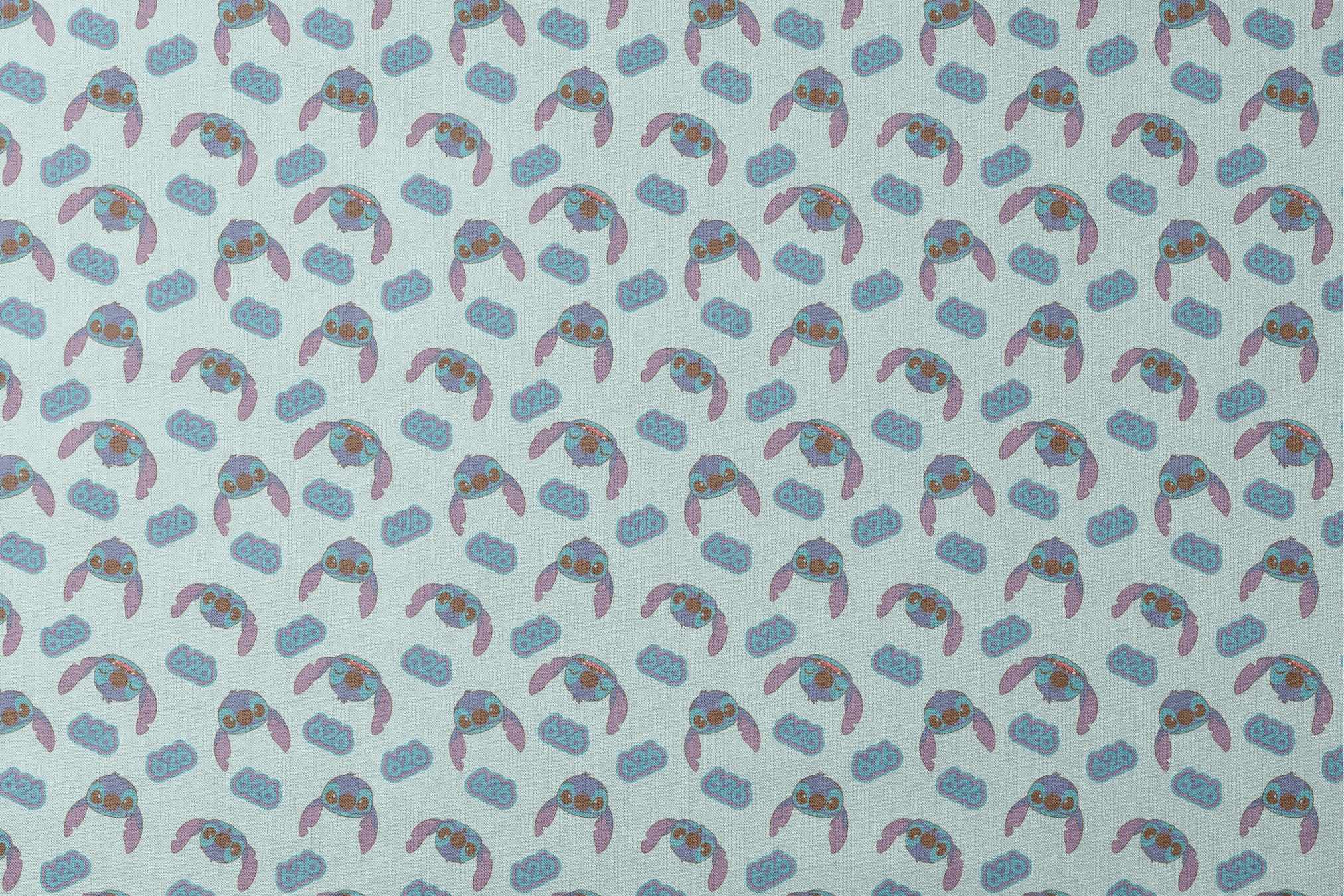 Blue cartoon creatures with large ears and swirl patterns on light teal background designs flat mockup