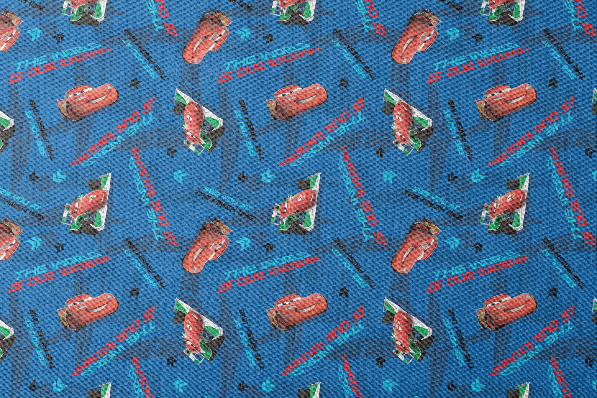 Blue fabric pattern with animated red race cars, "The World of Cars" text, and directional arrow designs designs flat mockup