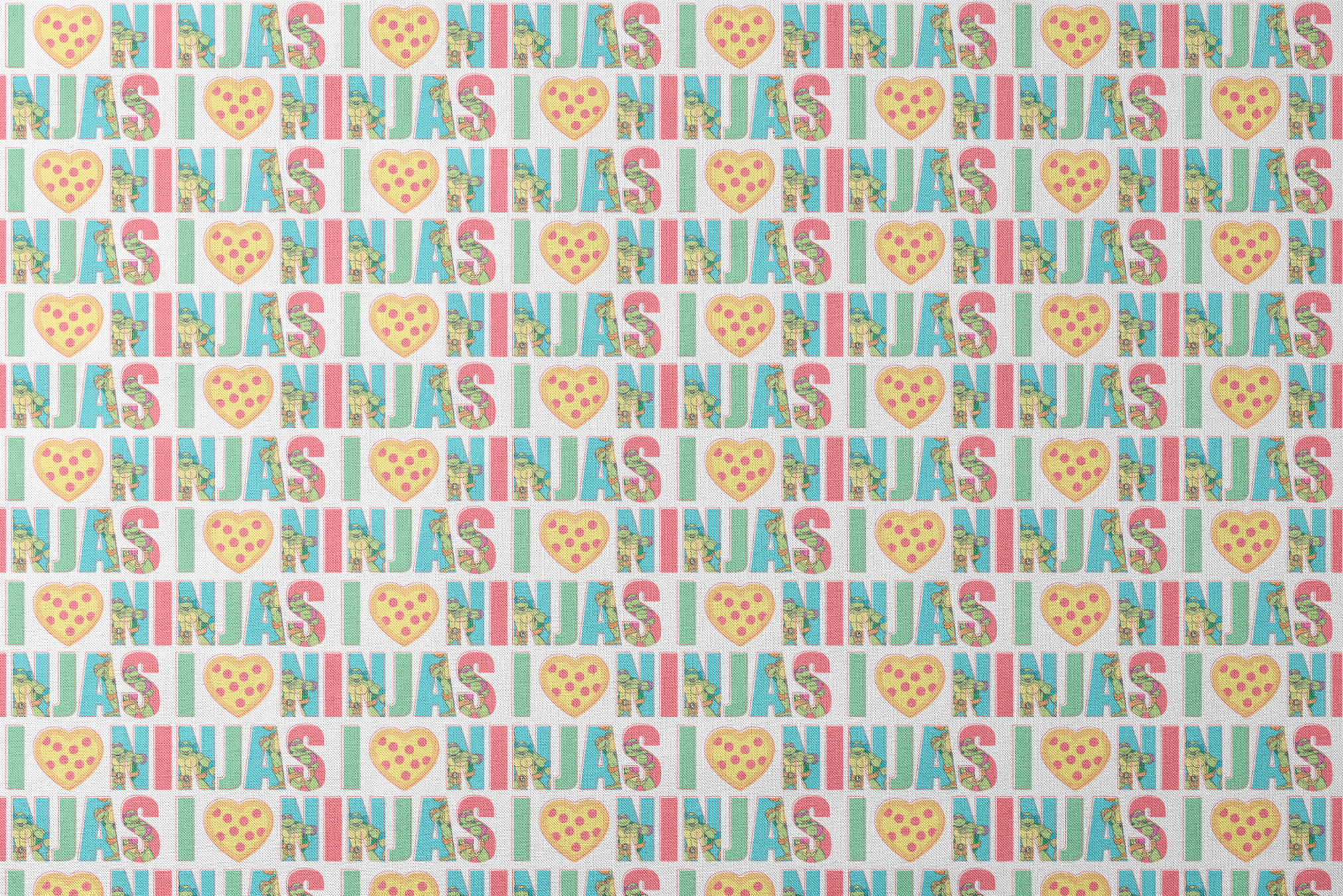 Teenage Mutant Ninja Turtles design with “I heart Ninjas” text with a pizza heart graphic, and Michelangelo and Leonardo in pastel colors. designs flat mockup
