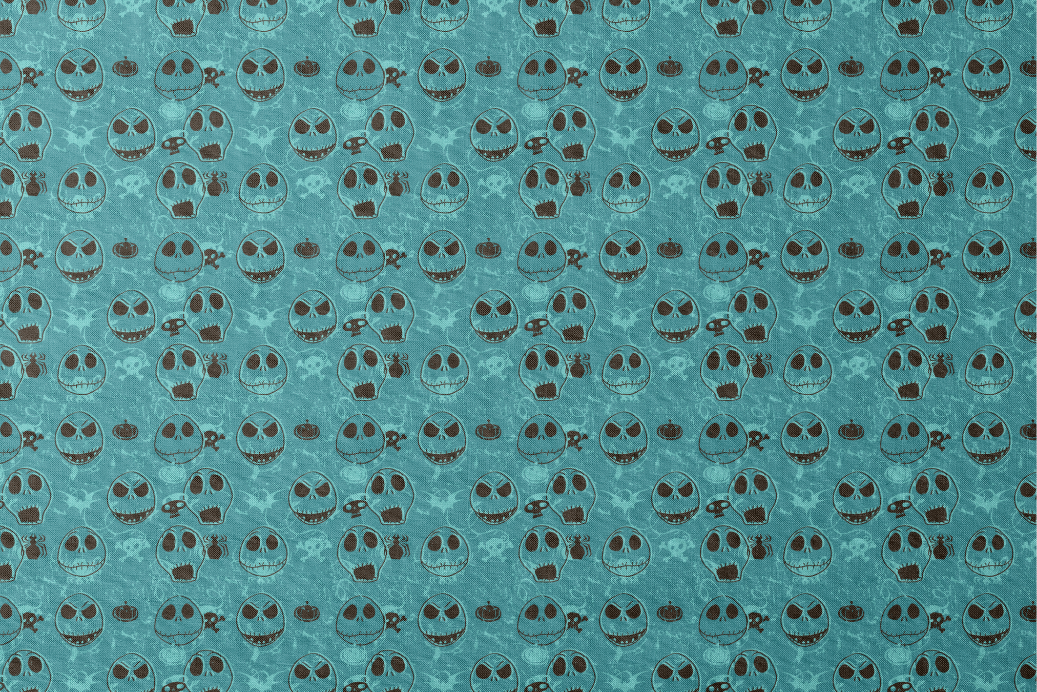 Teal pattern of cartoon skull faces with different expressions, Halloween elements like pumpkins and spiders designs flat mockup