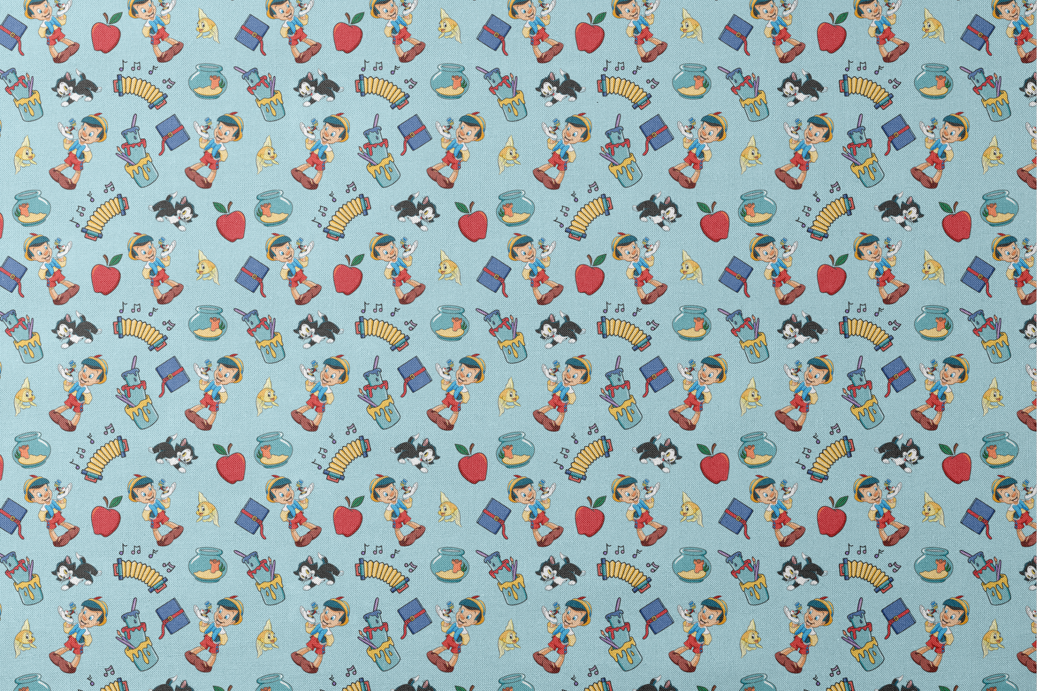 Cartoon pattern with wooden puppets, red apples, musical notes, goldfish bowls, cats, and books on light blue background designs flat mockup