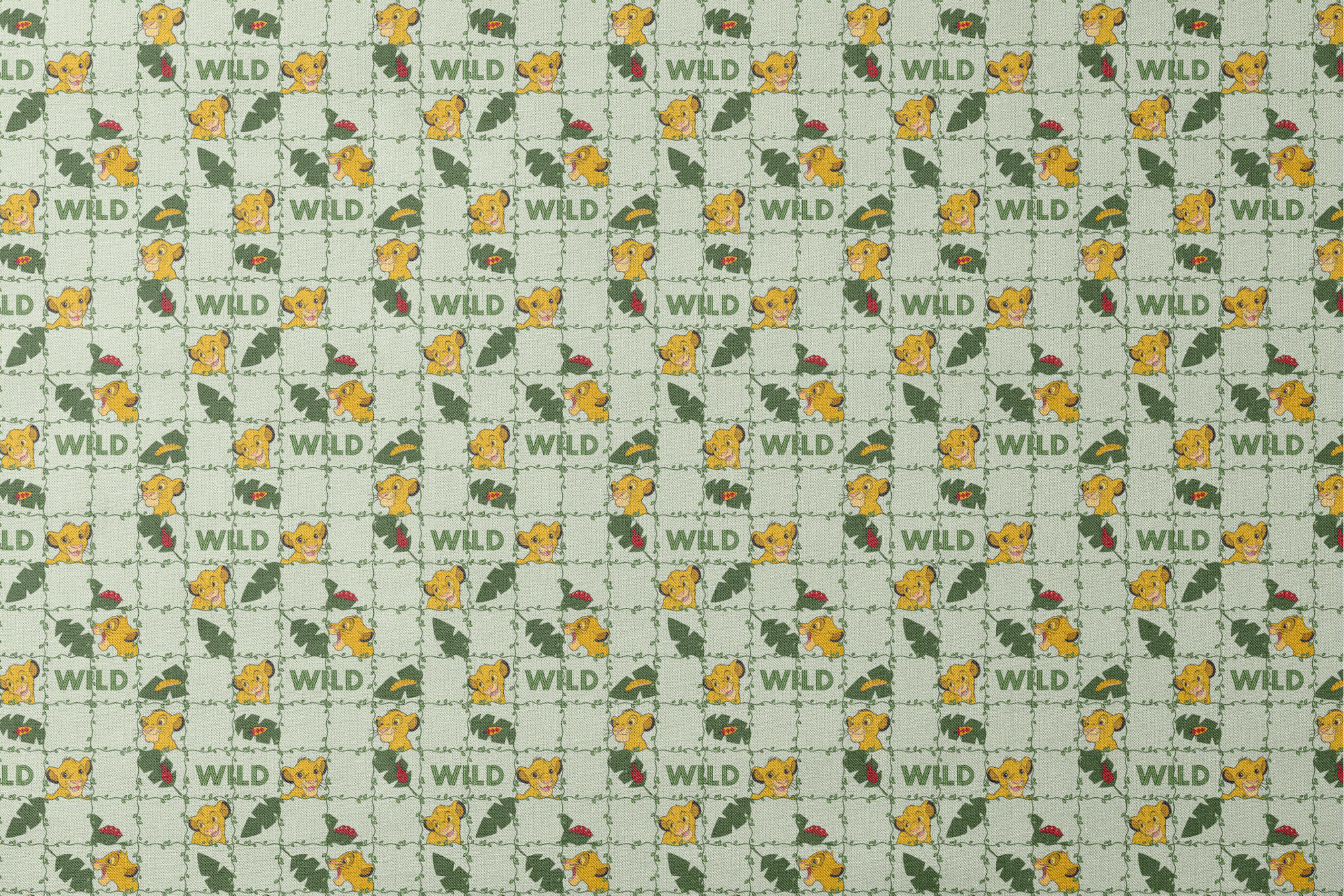 Young cartoon lion cubs with tropical leaves and "WILD" text on light green background pattern designs flat mockup