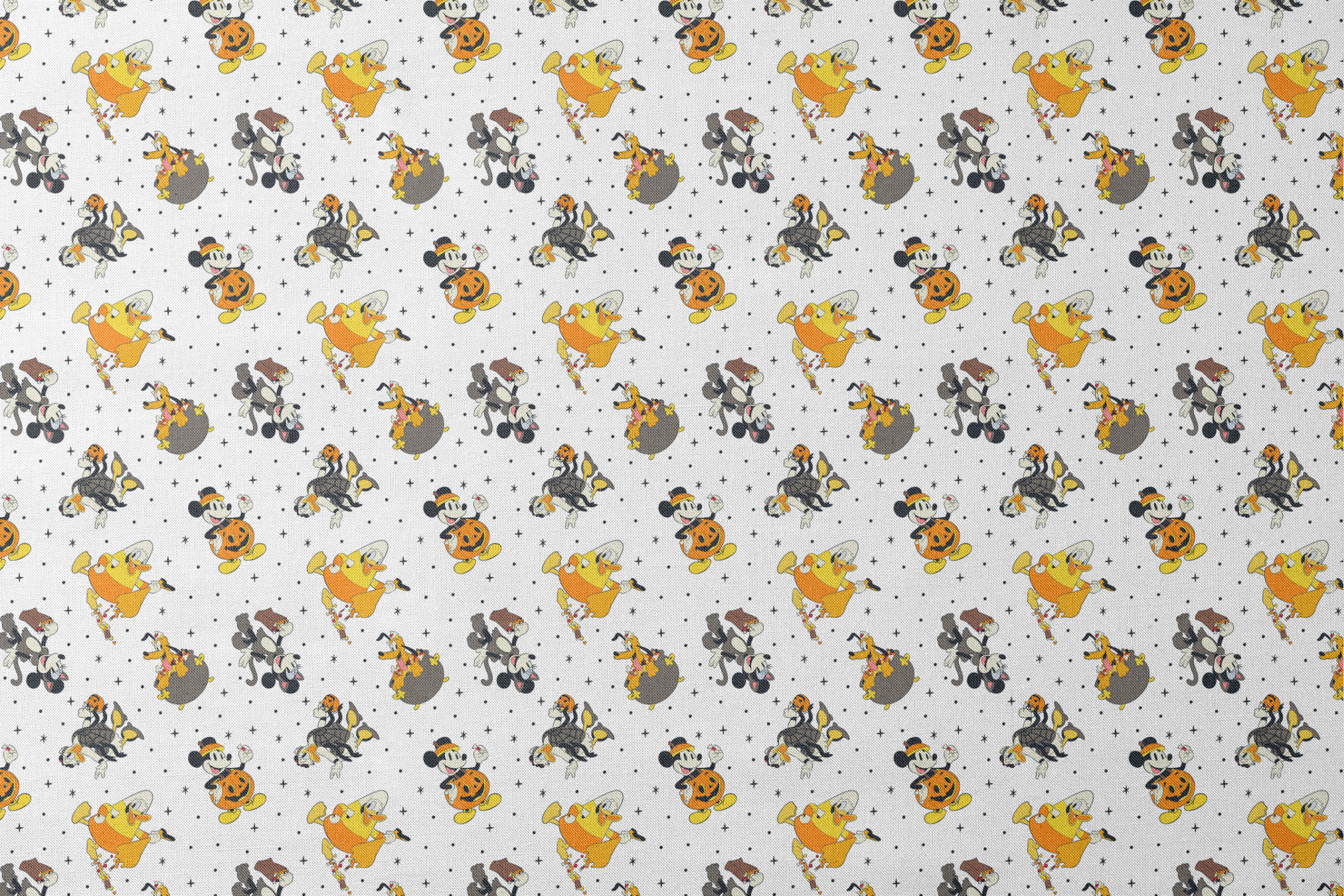 Disney characters in Halloween costumes on white background with stars - Mickey, Pluto, and friends in festive attire designs flat mockup