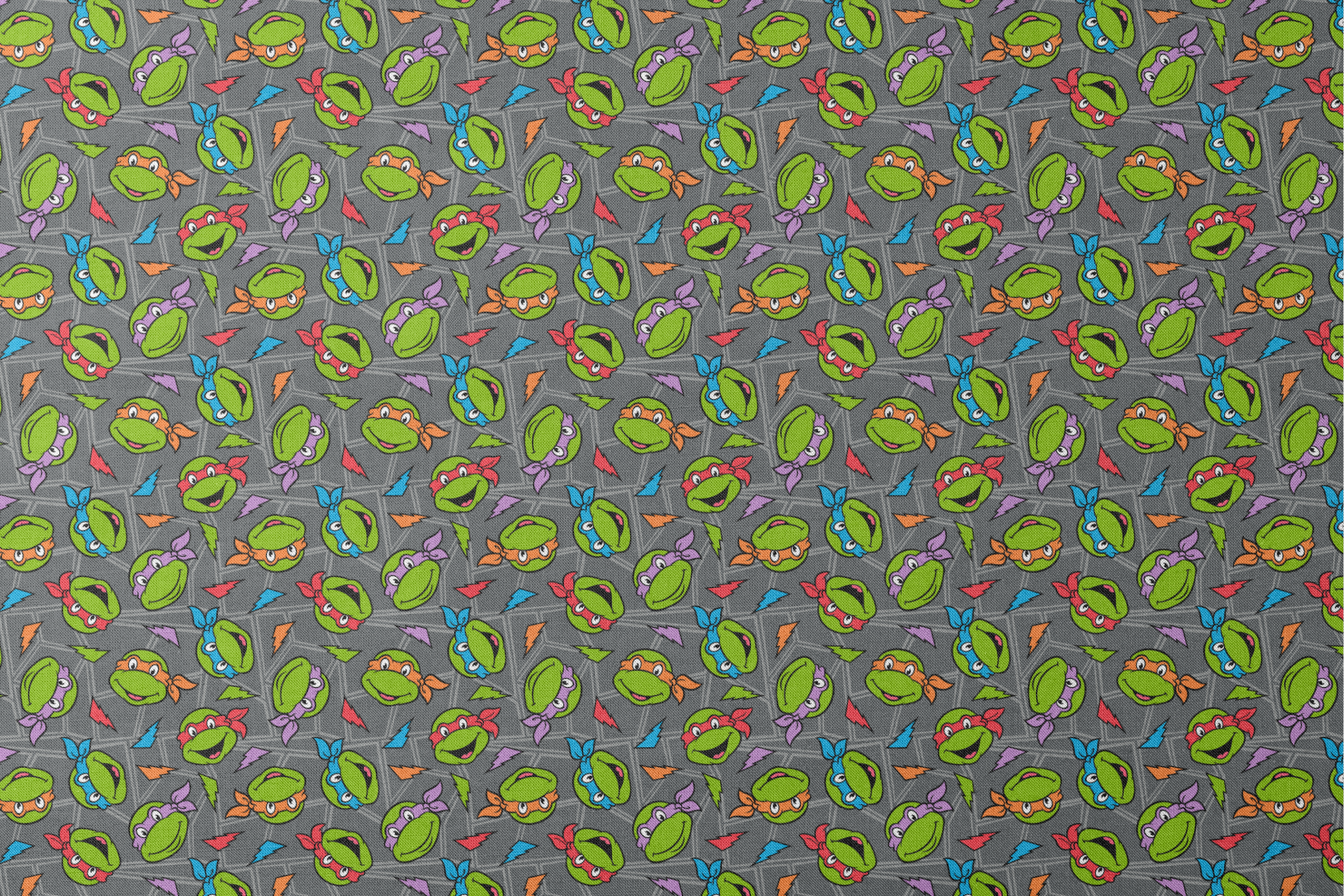 Colorful pattern of Teenage Mutant Ninja Turtles faces with red, orange, blue, and purple masks on grey background. designs flat mockup