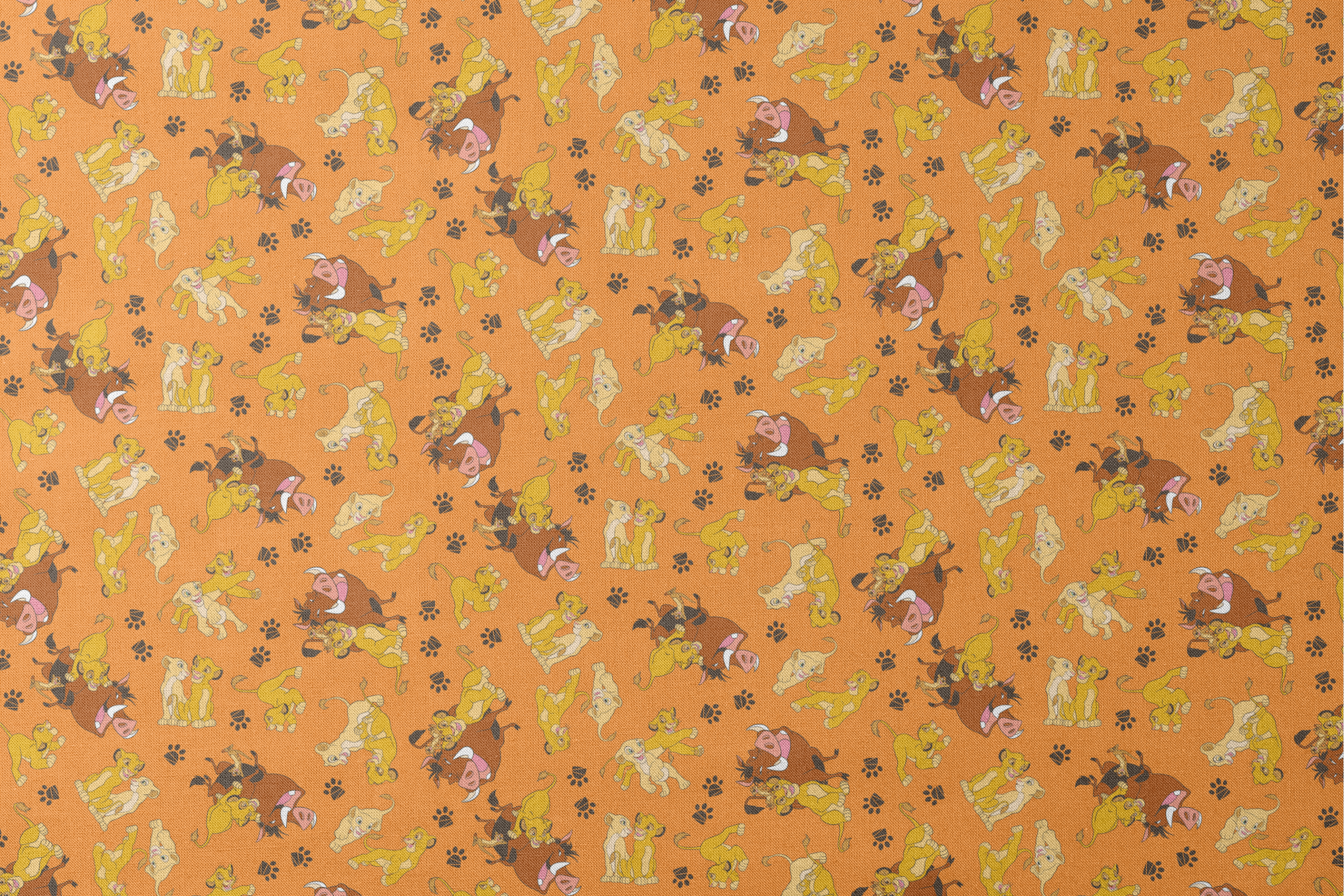 Playful pattern of cartoon cubs in yellow and brown poses on bright orange background with pawprints designs flat mockup