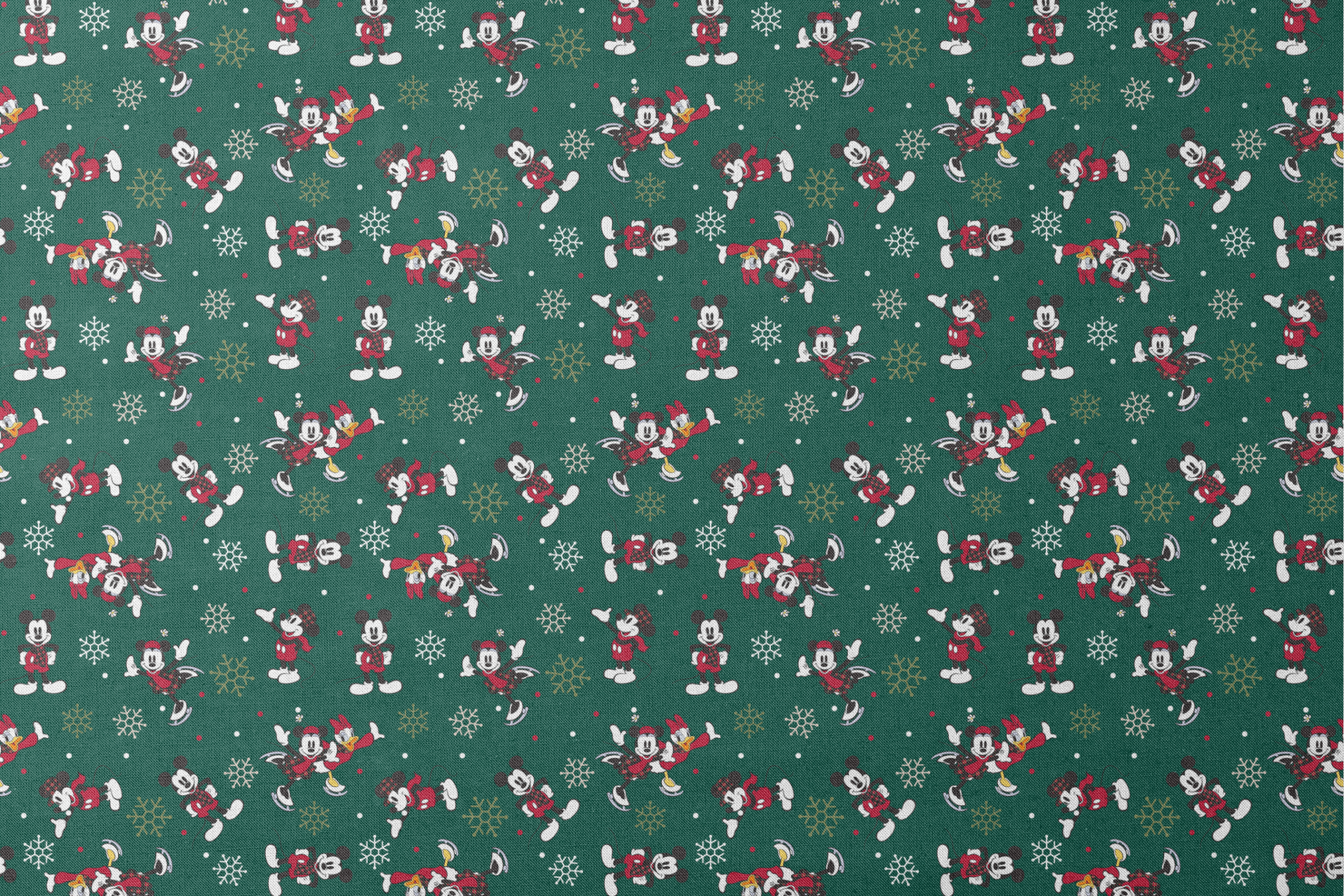 Mickey Mouse Christmas pattern with cartoon characters in winter outfits on green background with snowflakes designs flat mockup