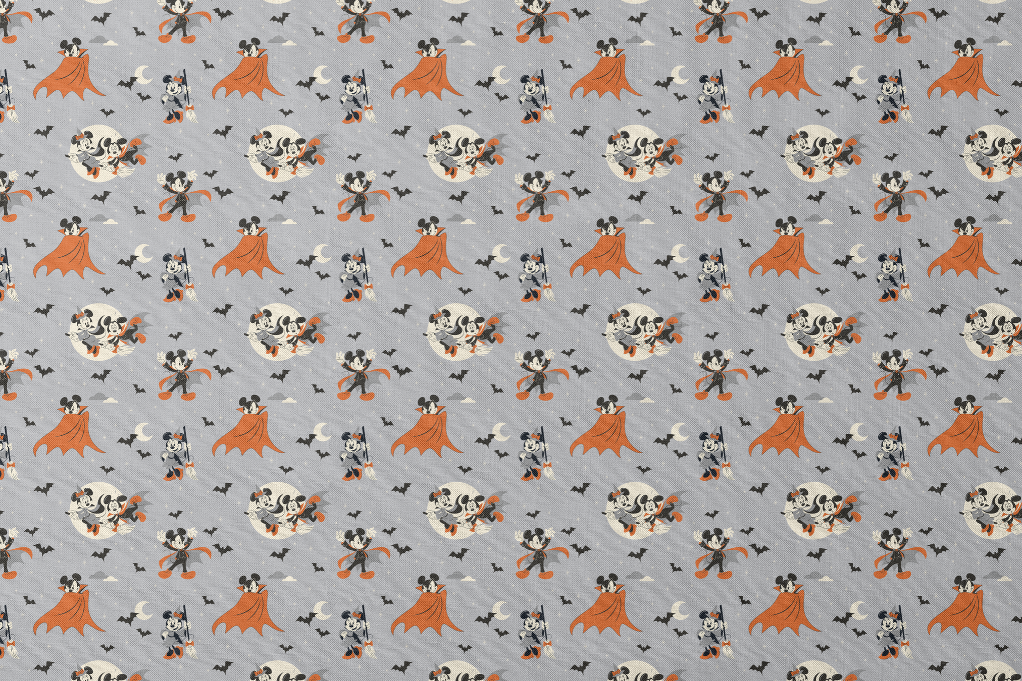 Mickey and Minnie Mouse in Halloween costumes on gray background with bats and moons, orange capes and spooky theme. designs flat mockup