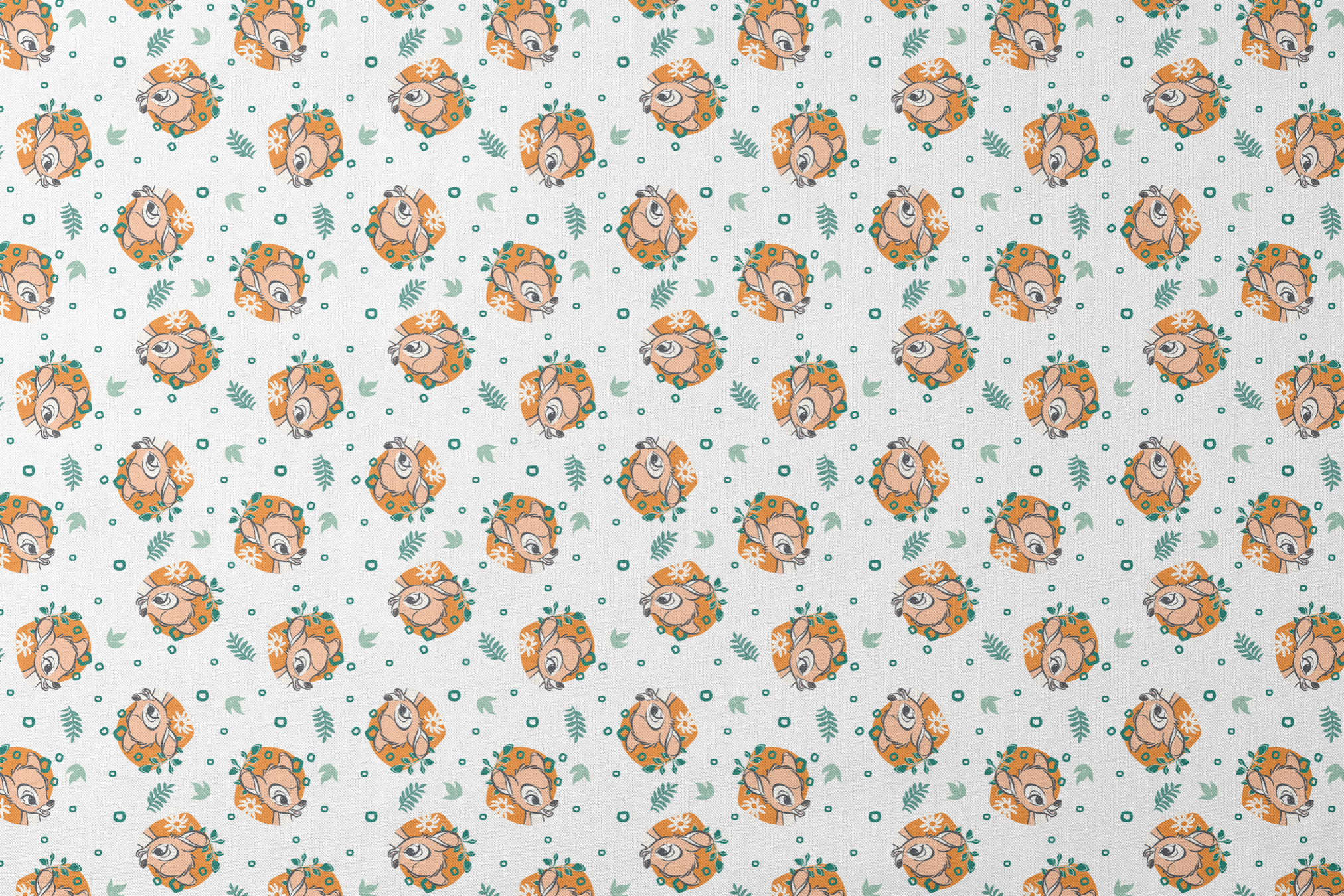 Disney’s Bambi illustrated in golden-orange floral medallions with green leaves and scattered geometric accents on a white background. designs flat mockup