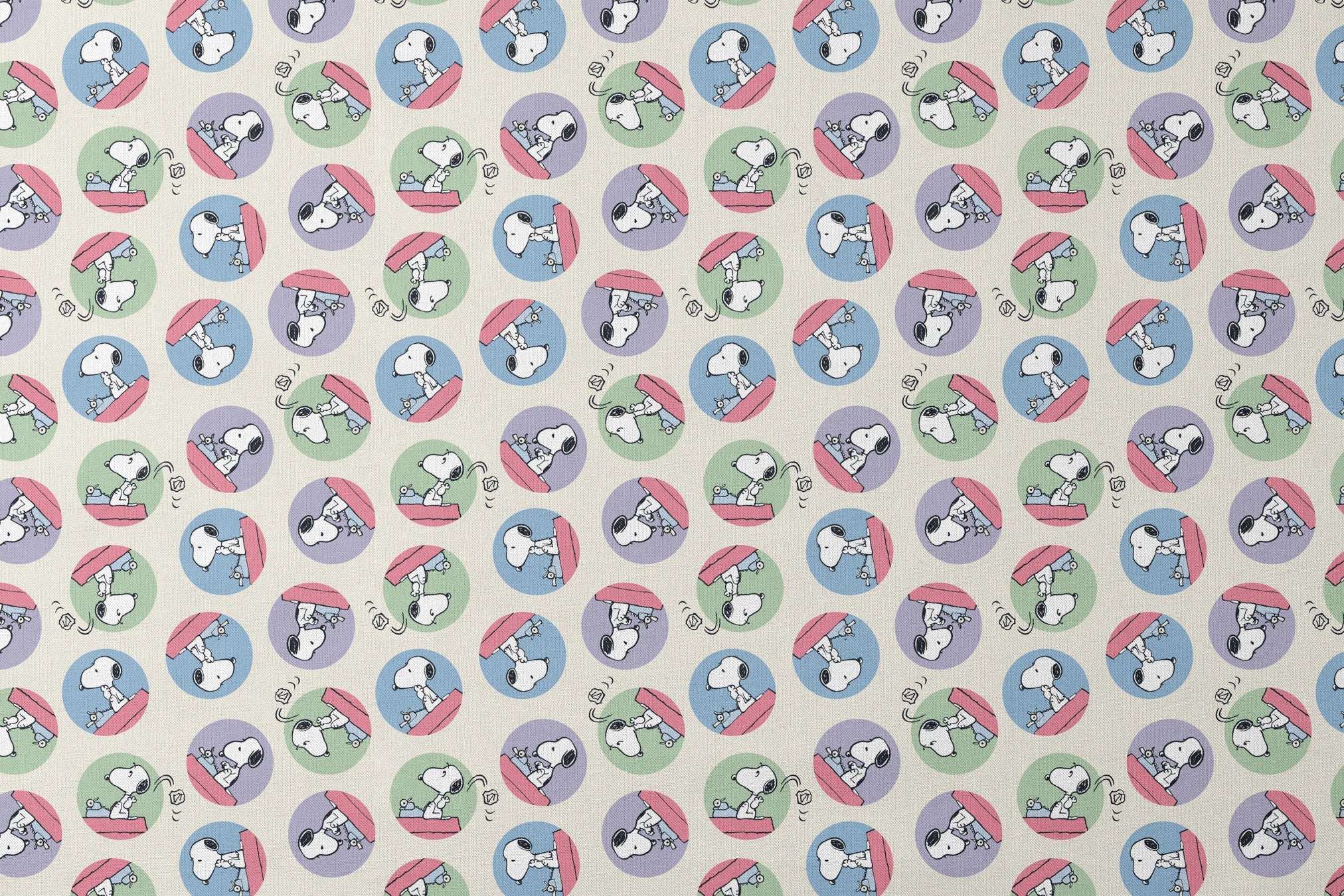 Cartoon Snoopy pattern with the beagle character in circular frames of blue, green, and purple backgrounds designs flat mockup