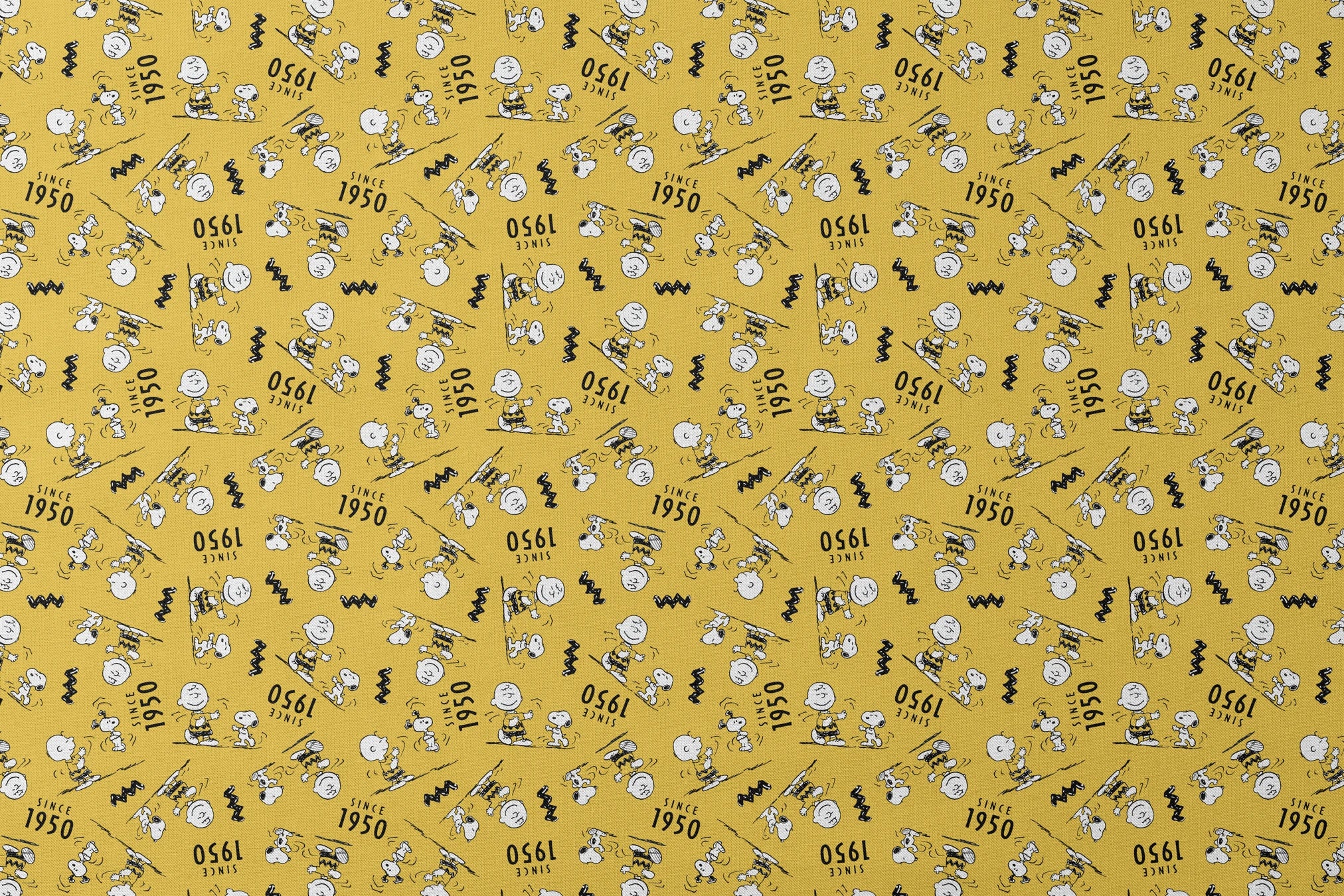 Peanuts cartoon pattern on yellow background with Snoopy and Charlie Brown, "Since 1950" text designs flat mockup