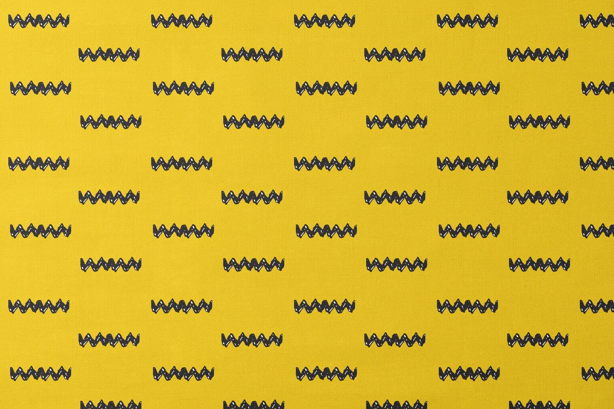 Black Charlie Brown zigzag patterns arranged in four rows against a bright yellow textured background designs flat mockup
