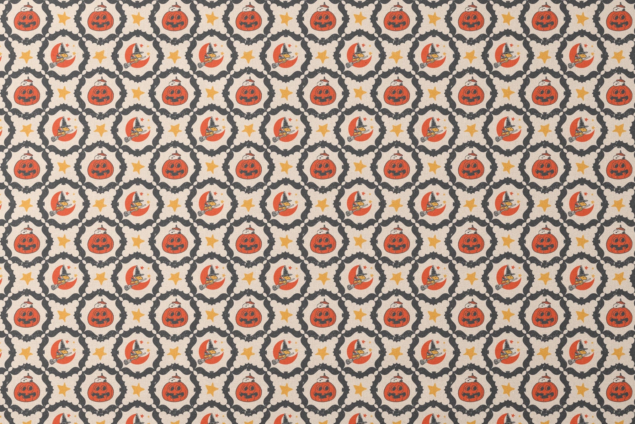 Peanuts Halloween pattern with orange jack-o'-lanterns, crescent moons with witch hats, yellow stars, and black bat borders on cream background designs flat mockup