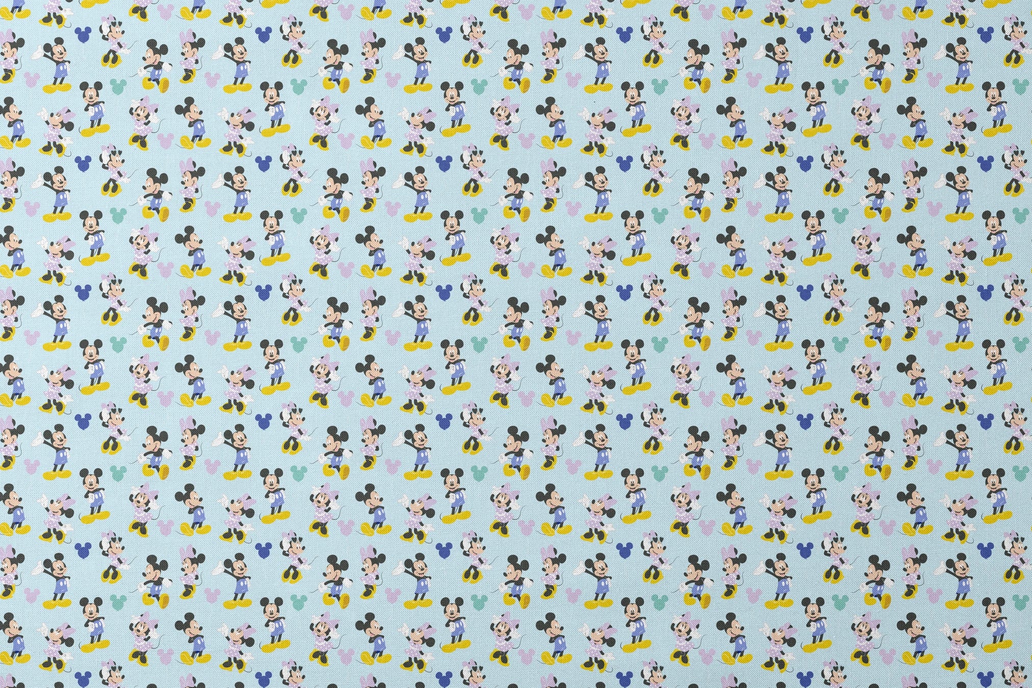 Pattern of Mickey and Minnie Mouse characters in various poses on light blue background designs flat mockup