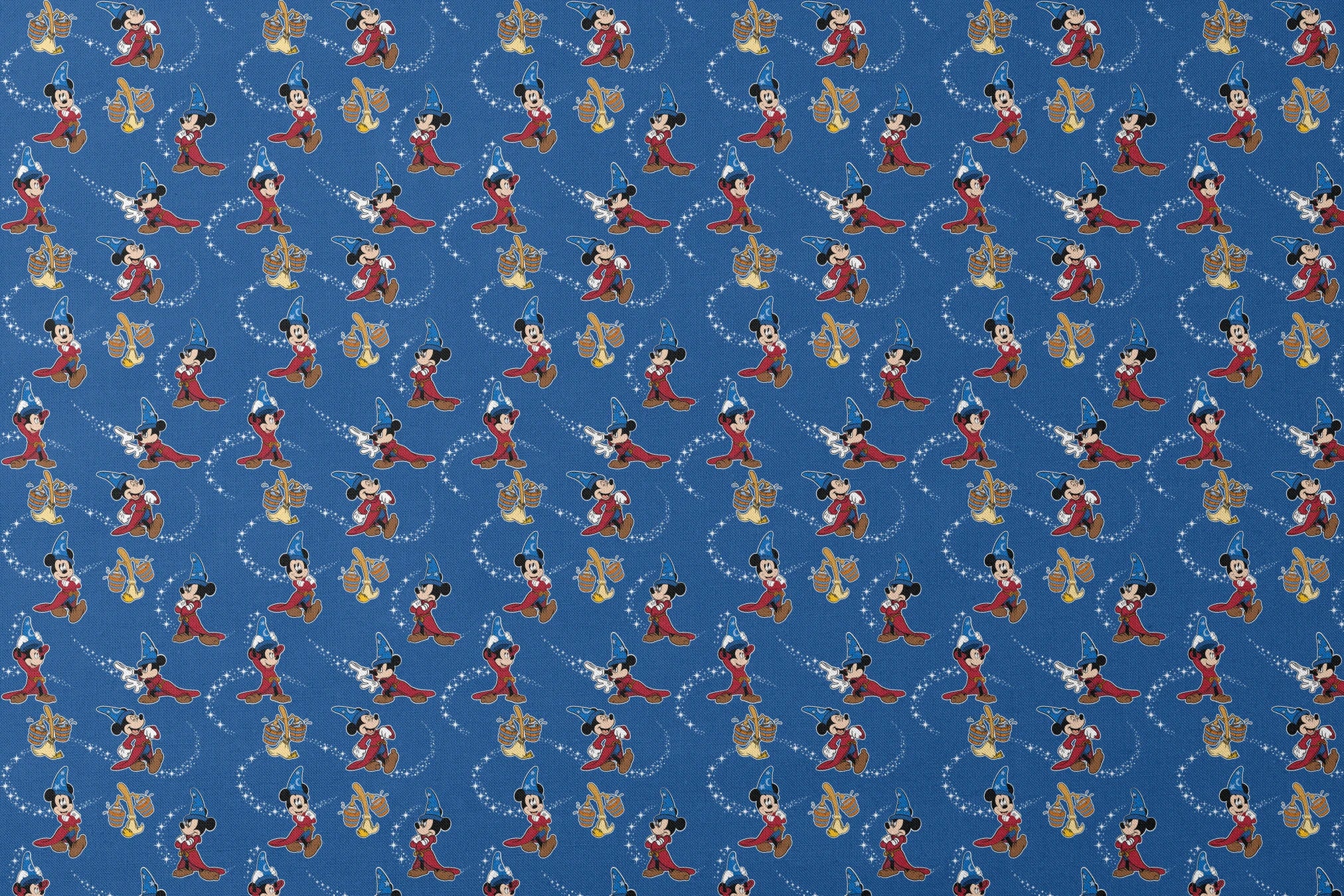 Mickey Mouse as Fantasia's Sorcerer's Apprentice in various poses with magic stars on blue background. designs flat mockup