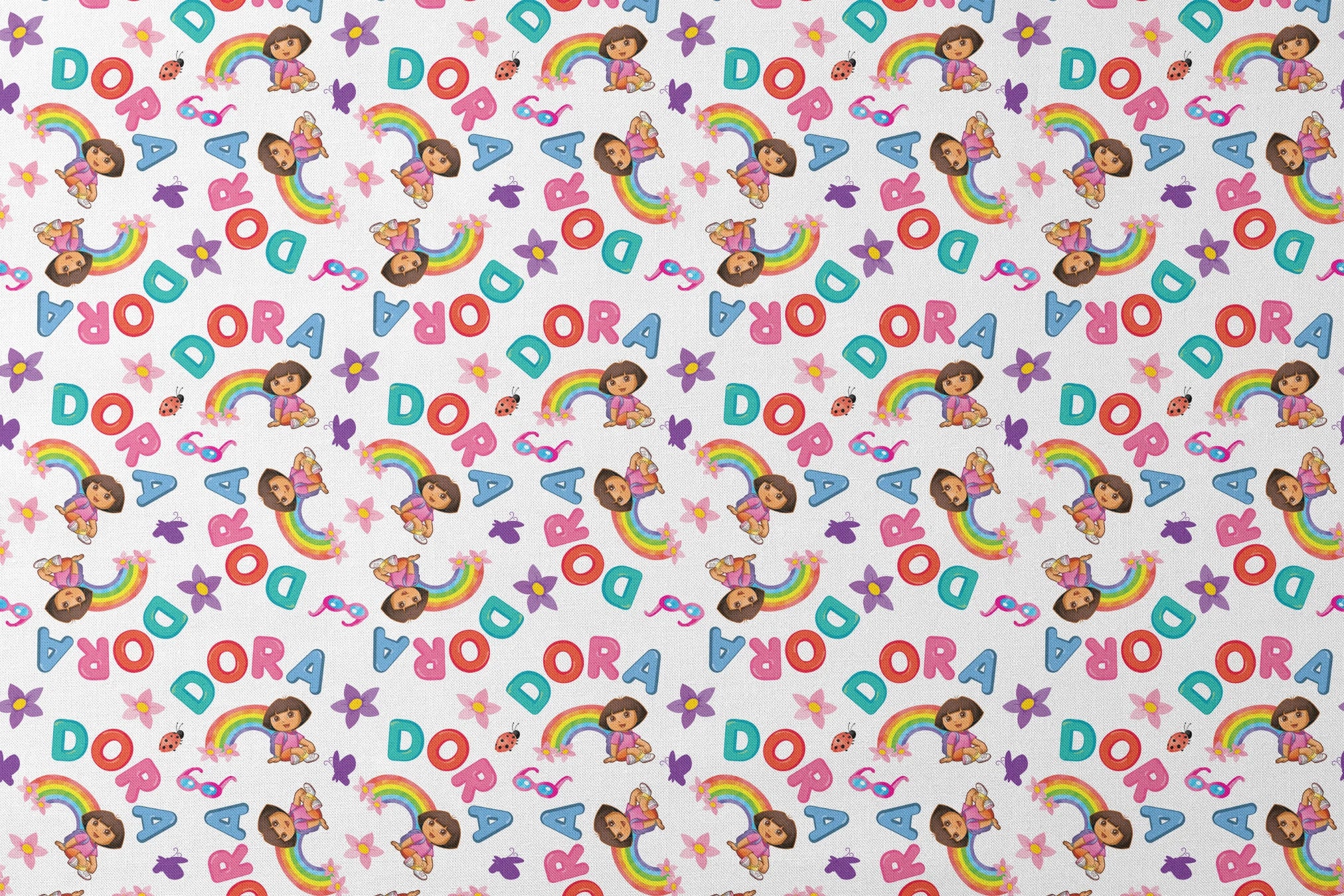 Colorful Dora pattern with rainbows, flowers, alongside scattered "DORA" letters on white background. designs flat mockup