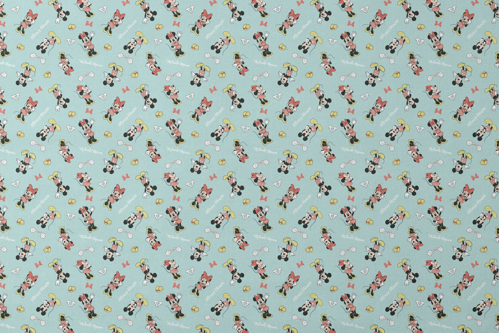 Mickey and Minnie Mouse pattern on light turquoise background with scattered characters, bows, and gloves designs flat mockup