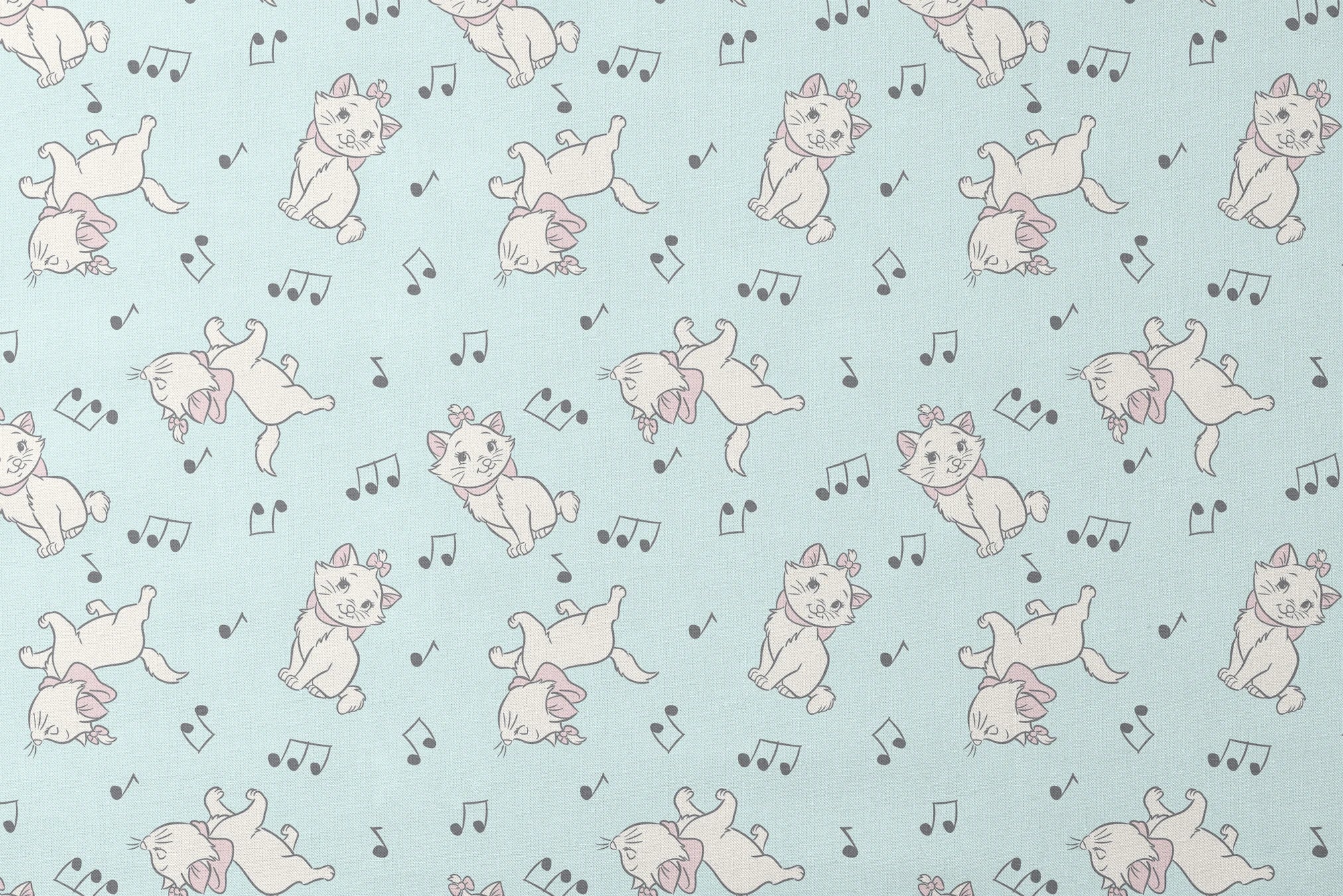 White kittens with pink bows playing among musical notes on a light mint background designs flat mockup