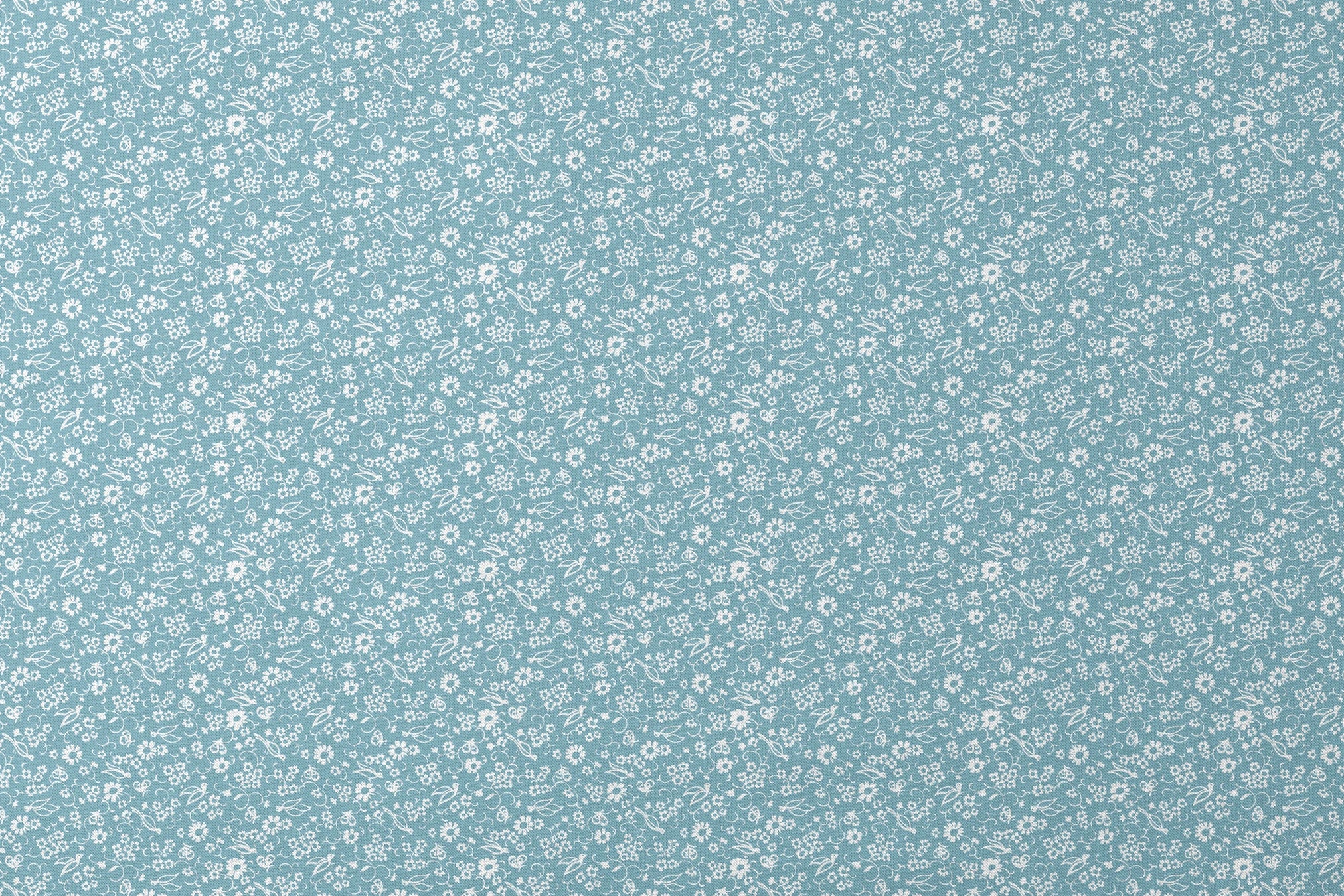 White vintage-style bird and floral silhouettes on a dusty blue background. designs flat mockup