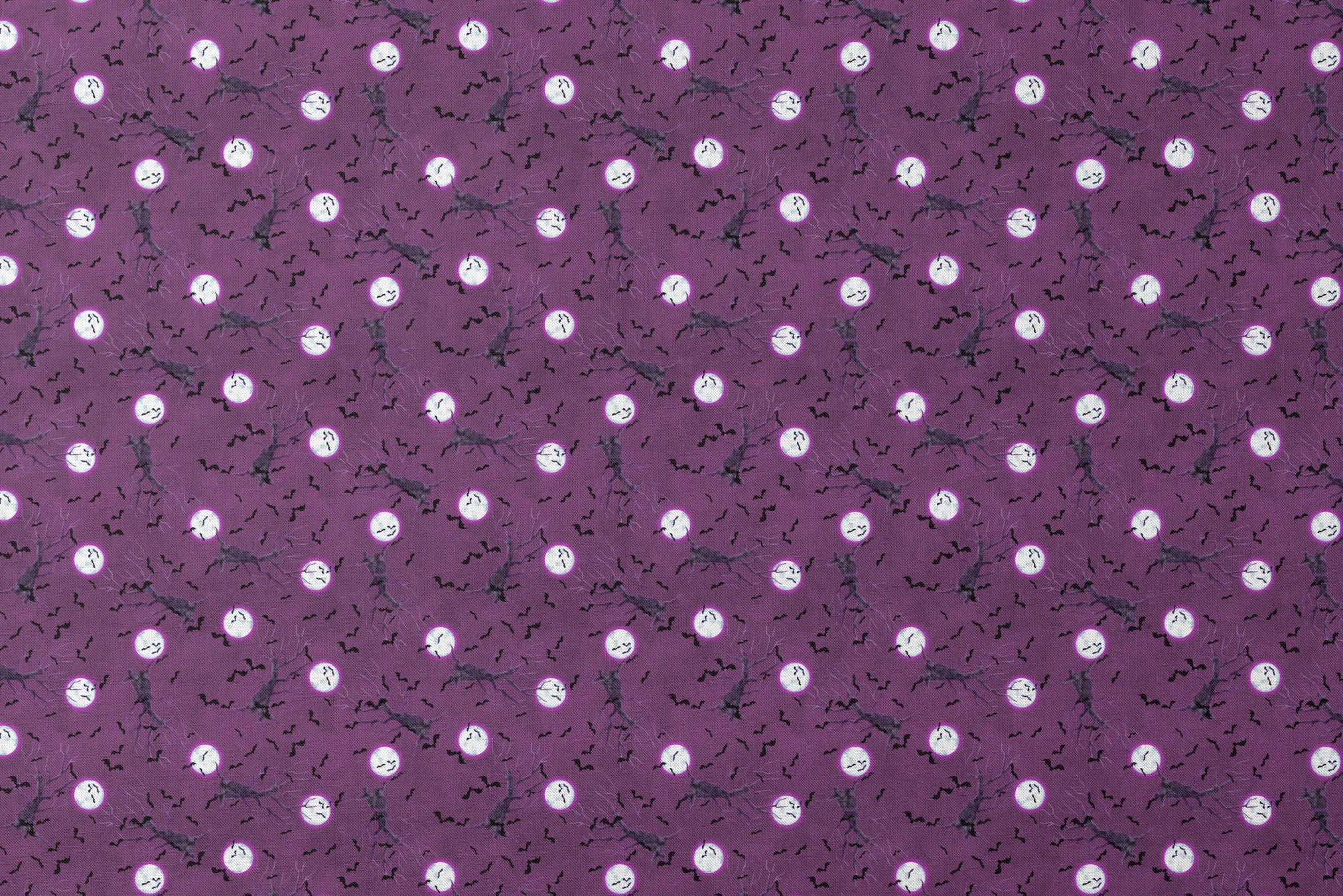 Halloween fabric design with spooky trees, bats, and glowing full moons on a purple background, illustrated by Nicole Tamarin. designs flat mockup