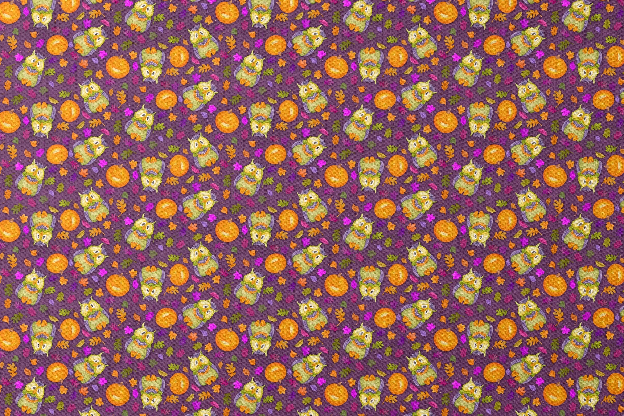 Halloween fabric by Nicole Tamarin featuring cartoon owls in costume, jack-o’-lanterns, and colorful fall leaves on a purple background. designs flat mockup