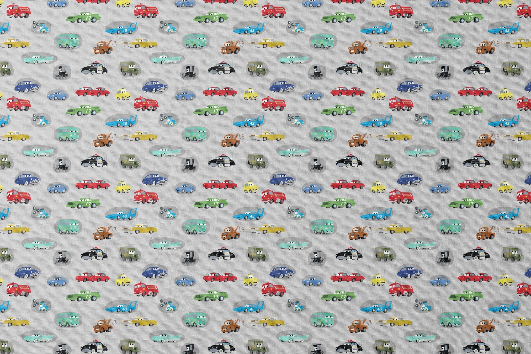 Various cartoon toy cars and vehicles in different colors (red, blue, green, yellow) displayed against a gray background with cute animated faces. designs flat mockup