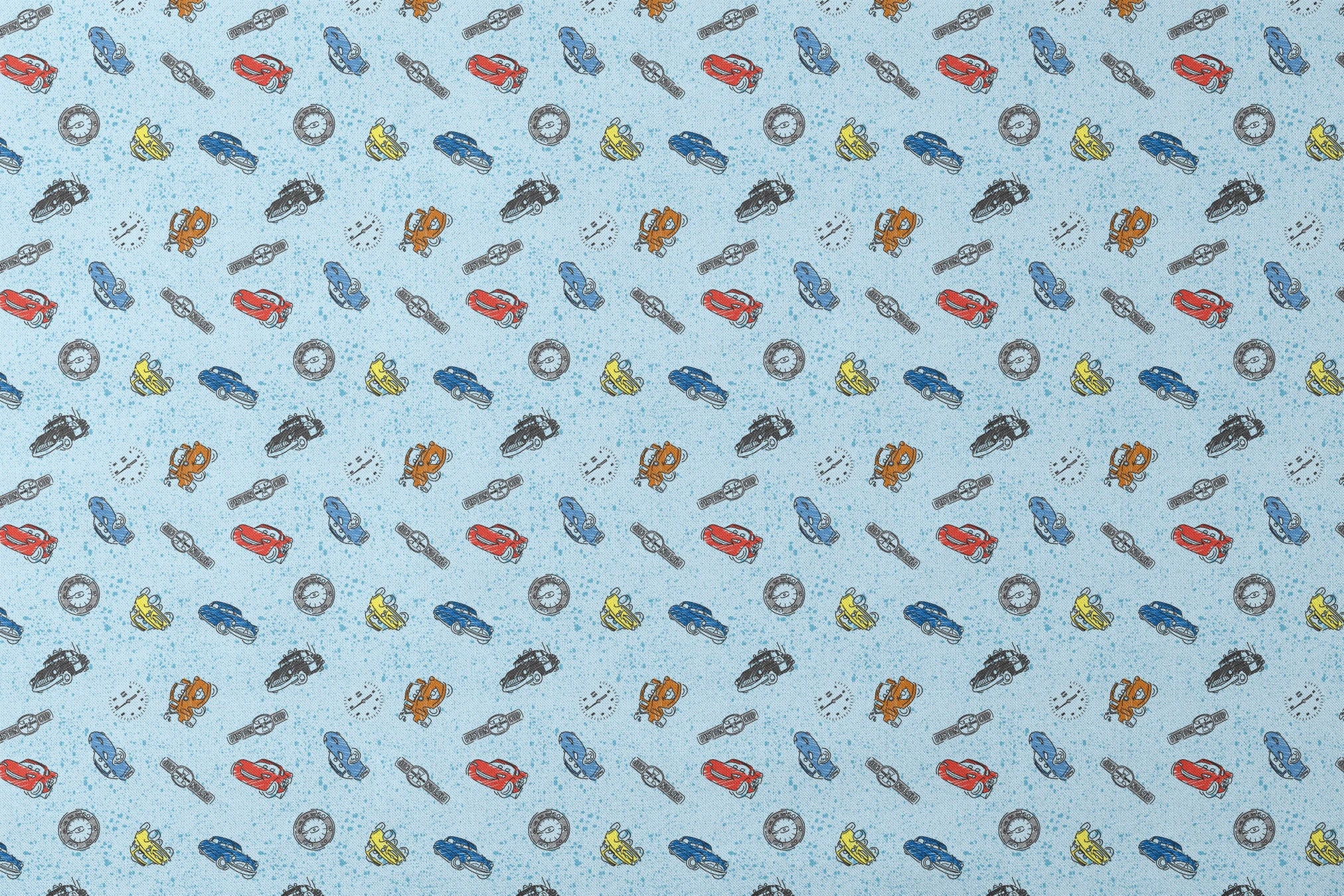 Colorful cartoon cars and watches scattered on a light blue speckled background pattern designs flat mockup