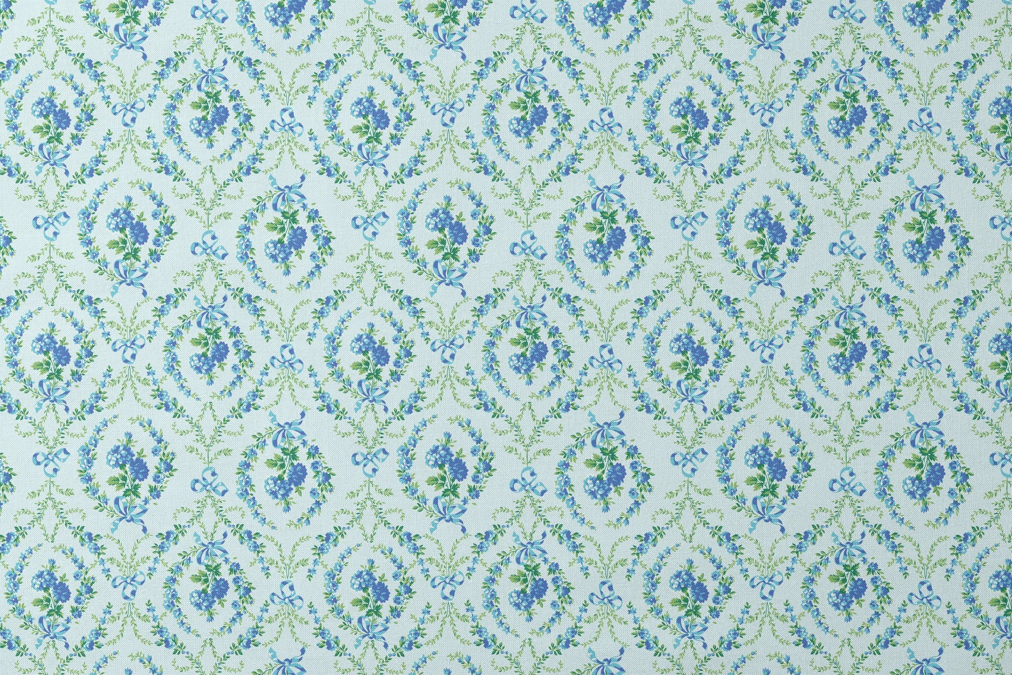 Blue floral pattern with diamond lattice design featuring delicate ribbons and green foliage on light background designs flat mockup