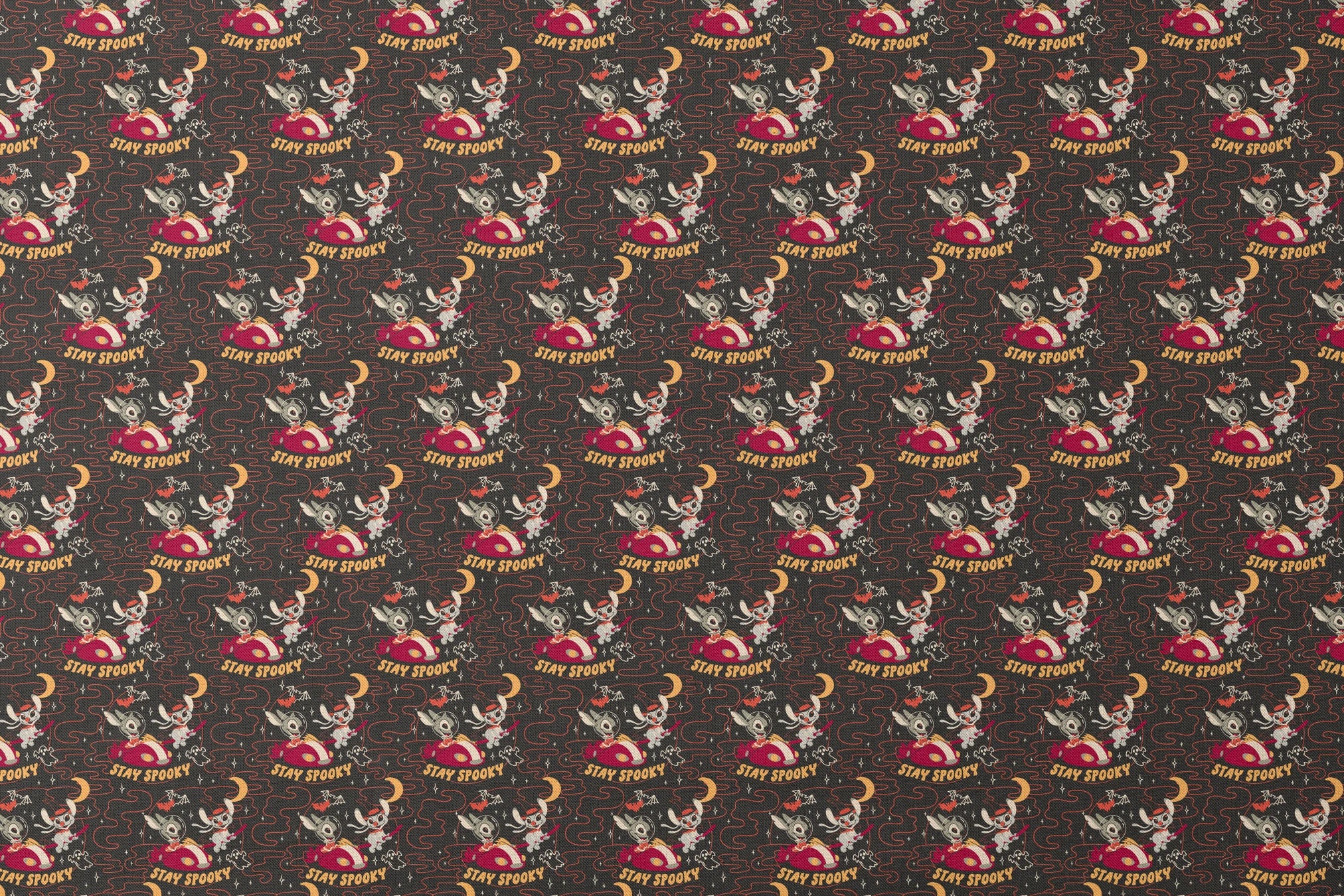 Repeating Halloween pattern with Stitch, "STAY SPOOKY" text, crescent moons, and swirling red lines on dark background. designs flat mockup