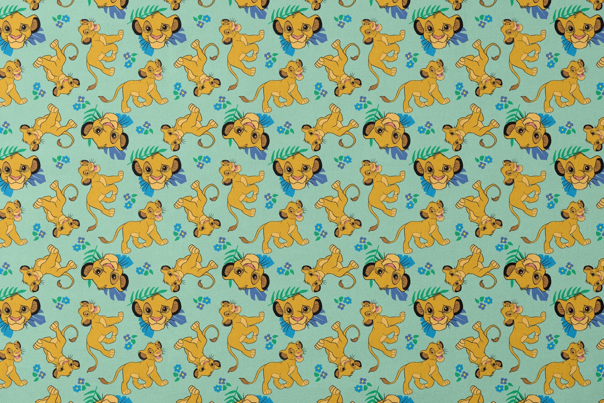 Cartoon lion cubs playing on mint green background with blue flowers and green leaves pattern designs flat mockup