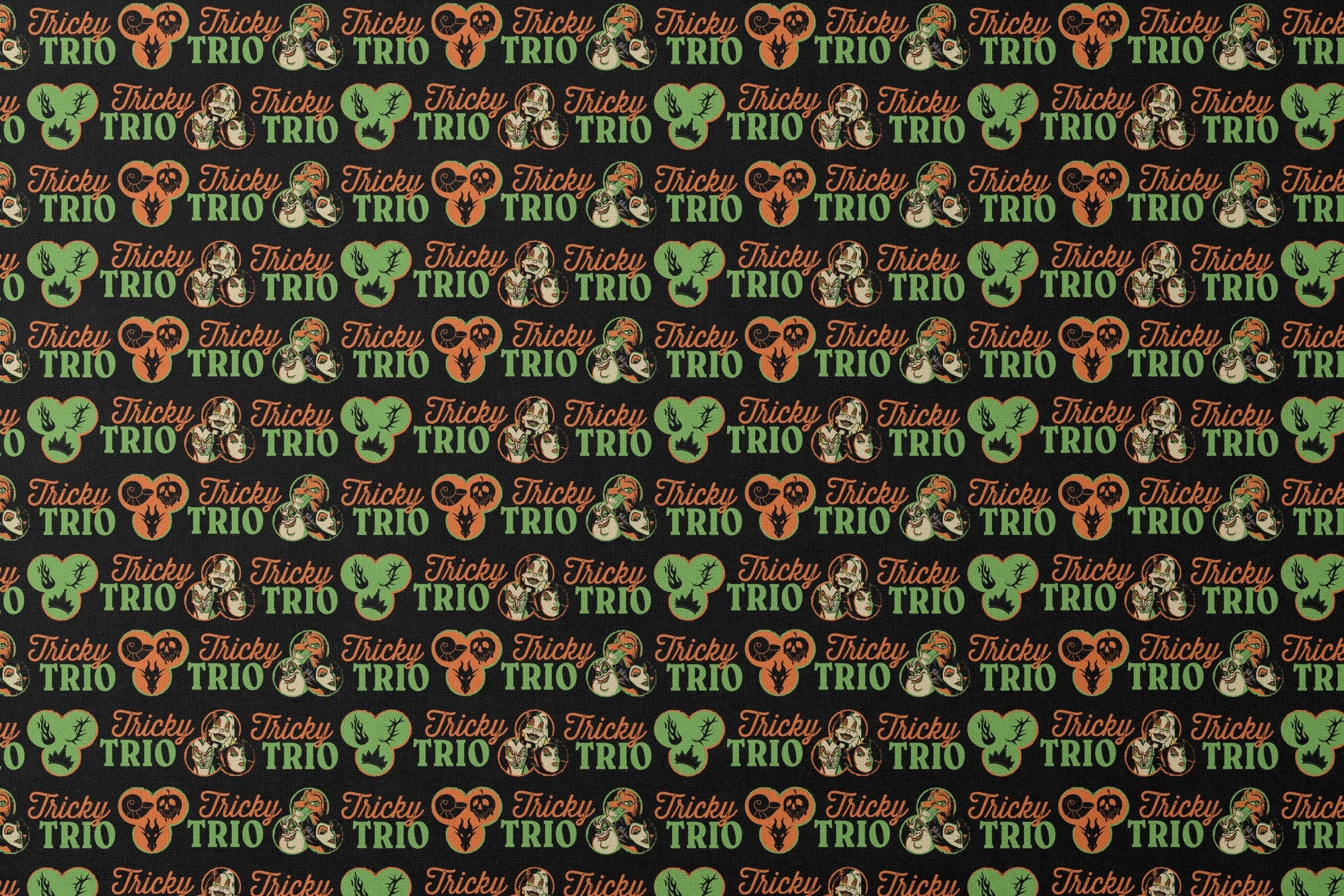 Disney Halloween pattern with "Tricky TRIO" text in orange and green, featuring Disney Villains, pumpkins, and ghostly designs on black background designs flat mockup