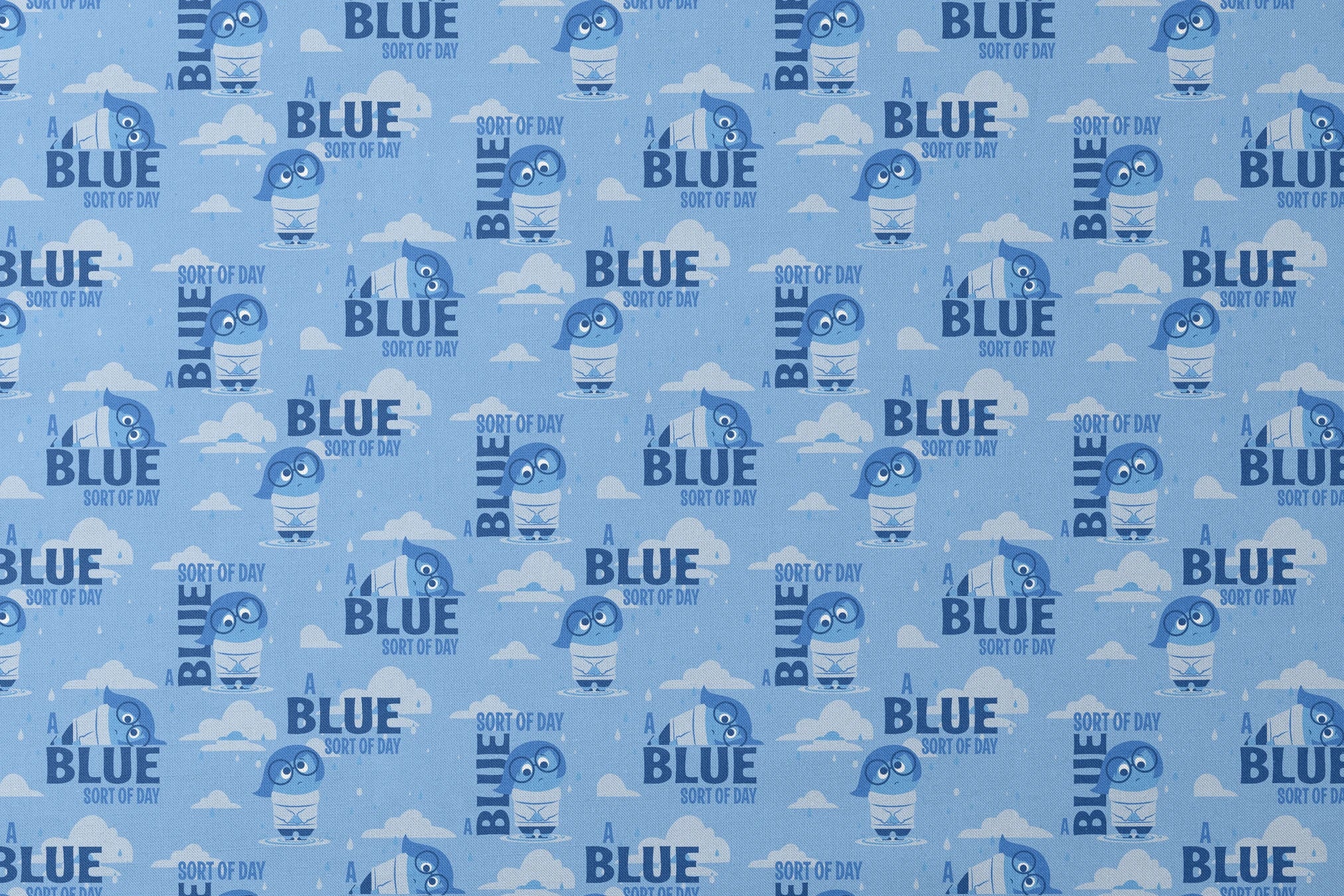 Sadness from Disney and Pixar's Inside Out pattern with "BLUE SORT OF DAY" text on light blue background with clouds designs flat mockup
